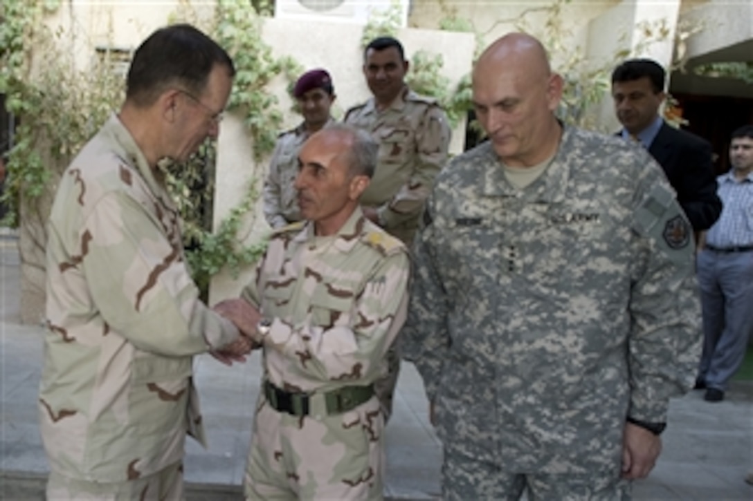 Chairman of the Joint Chiefs of Staff Adm. Mike Mullen, U.S. Navy, and Commanding General U.S. Forces Iraq Gen. Raymond T. Odierno bid farewell to Iraqi Armed Forces Chief of Staff Gen. Babaker Zibari in Baghdad, Iraq, on July 27, 2010.  Mullen's final stop in Iraq wraps up the ten-day around the world trip to meet with counterparts and troops engaged in the war on terrorism.  