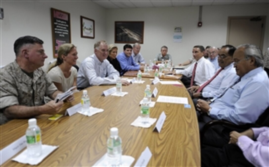 Deputy Secretary of Defense William J. Lynn III talks with Saipan's Governor Bengnino Fitial during a working lunch on the island of Saipan on July 28, 2010.  