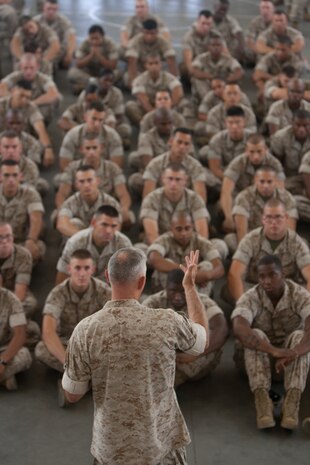 General James T. Conway, the 34th Commandant of the Marine Corps, answers a Marine's question during a town hall discussion at Floyd Bennett Field, Brooklyn, N.Y., July 29. He became the first commandant to visit 6th Communications Battalion's headquarters. The Marine battalion was relocated from Fort Schuyler, Bronx to Floyd Bennett Field in 1997.(Official Marine Corps photo by Sgt. Randall A. Clinton / RELEASED)