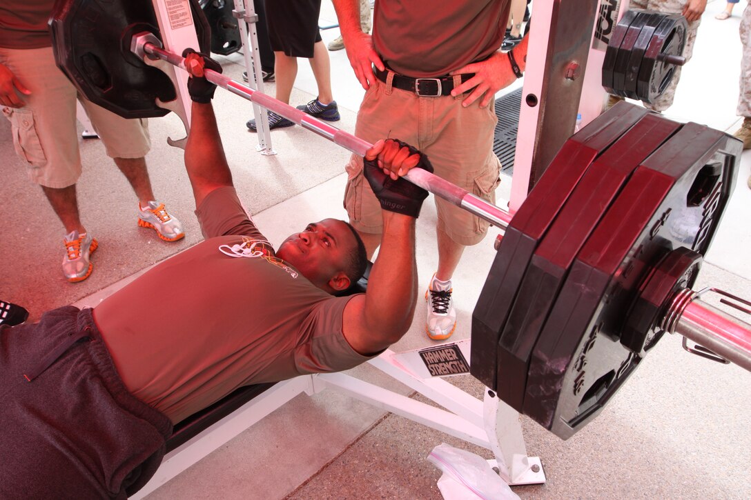 Sgt. Isaac Norales, field artillery radar operator, 11th Marine Regiment, 1st Marine Division, lifts 335 pounds during the second installment of the Camp Pendleton 2010 Bench Press Challenge Series at the 21 Area Fitness Center, July 30. During each event of the three-part series, winners are awarded, but during the last contest of the series, there will be an overall award for the man and woman who have accumulated the most points. The final event of the series will take place Oct. 22, at the 52 Area Fitness Center.