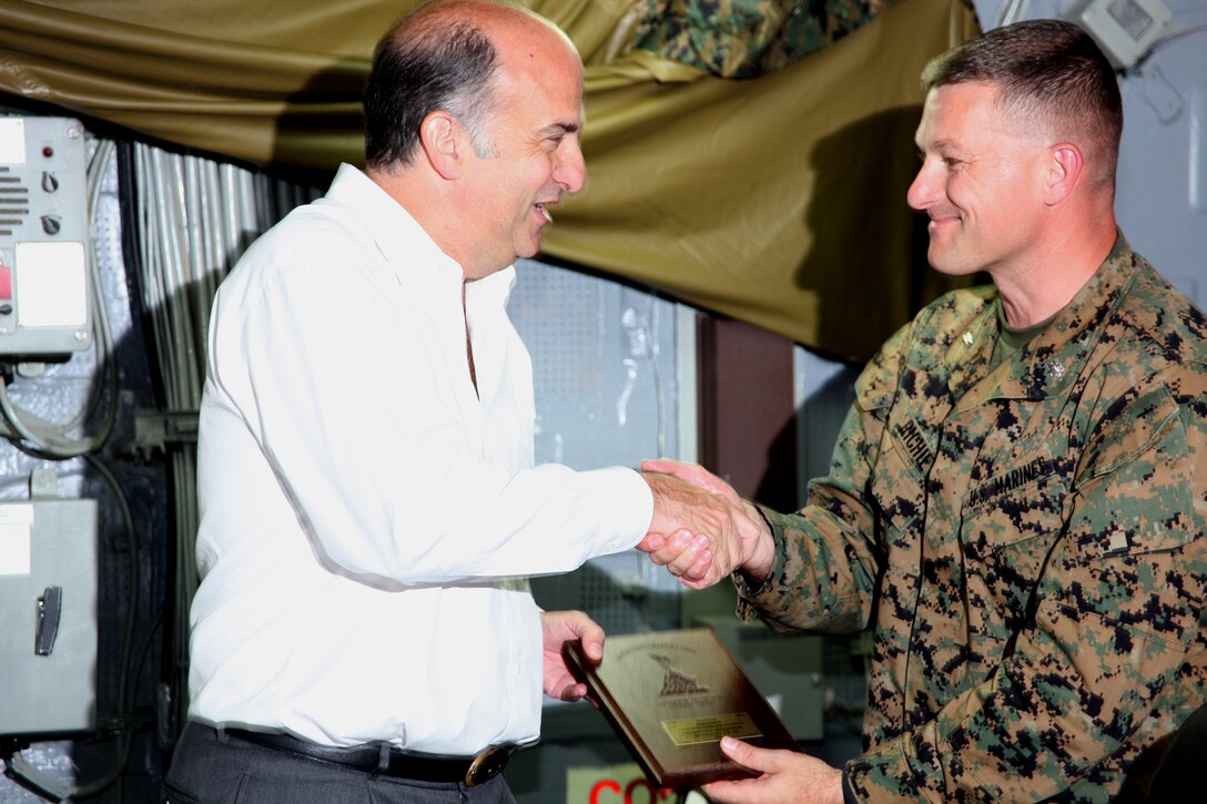 Navy Capt. Michael T. Hopkins, the senior medical officer of the USS Iwo Jima, explains the use of the ship’s medical ward to Kenneth Merten, Haiti ambassador, and Uruguay Navy Capt. Gonzalo Cunarro, Chief Maritime Operations Minustah, during their visit to the USS Iwo Jima, July 30. The ambassador and other distinguished visitors toured the multipurpose amphibious assault ship with Sailors and Marines during Operation Continuing Promise 2010, and learned about the mission of CP10.