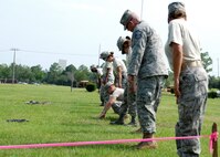 Members of the 919th Services Flight conduct search and recovery actions as part of their annual field training July 10 during the unit training assembly.  The training exercise honed the Reservists' wartime readiness skills (U.S. Air Force photo/Tech. Sgt. Cheryl Foster)
