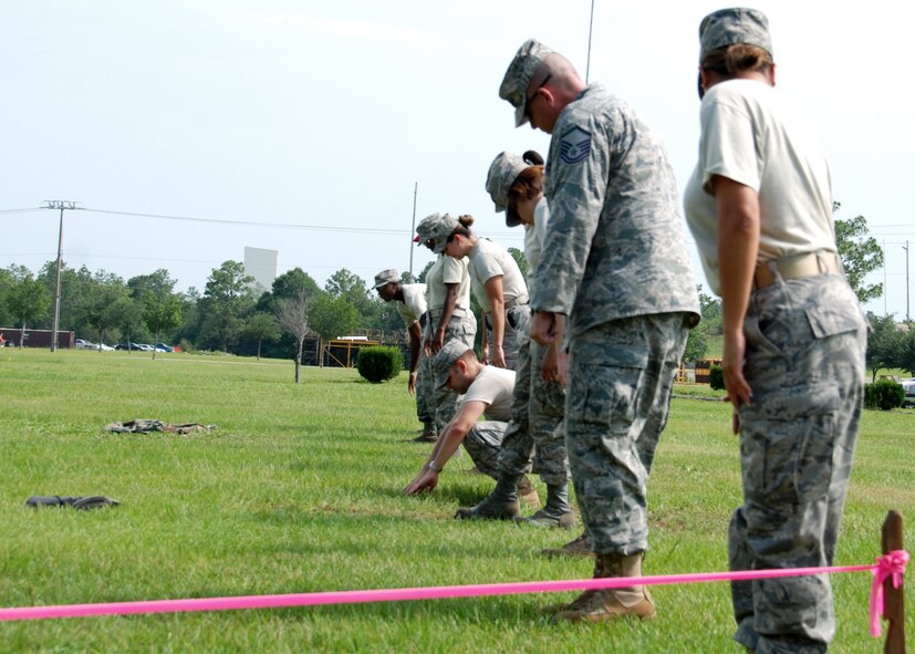 Members of the 919th Services Flight conduct search and recovery actions as part of their annual field training July 10 during the unit training assembly.  The training exercise honed the Reservists' wartime readiness skills (U.S. Air Force photo/Tech. Sgt. Cheryl Foster)
