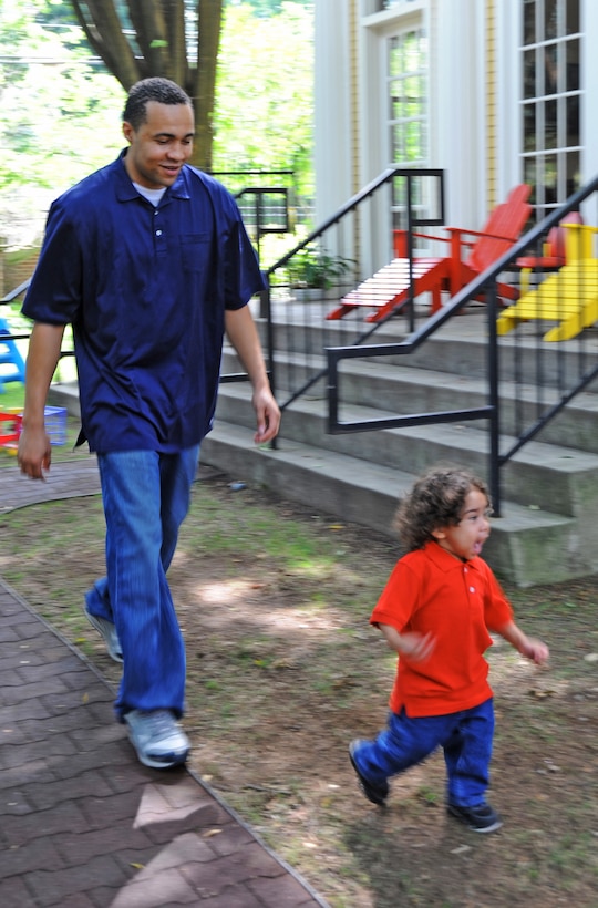 Mario and Genghis Webb play a game of "monster chase" in the backyard of the Ronald McDonald House July 20, 2010, in New Haven, Conn. The Webb family has been staying at the Ronald McDonald House following Genghis liver transplant surgery in April, when his father, Senior Airman Mario Webb, donated 20 percent of his liver to his son. Airman Webb is assigned to the 23rd Special Tactics Squadron at Hurlburt Field, Fla. (U.S. Air Force photo/Staff Sgt. Mareshah Haynes)