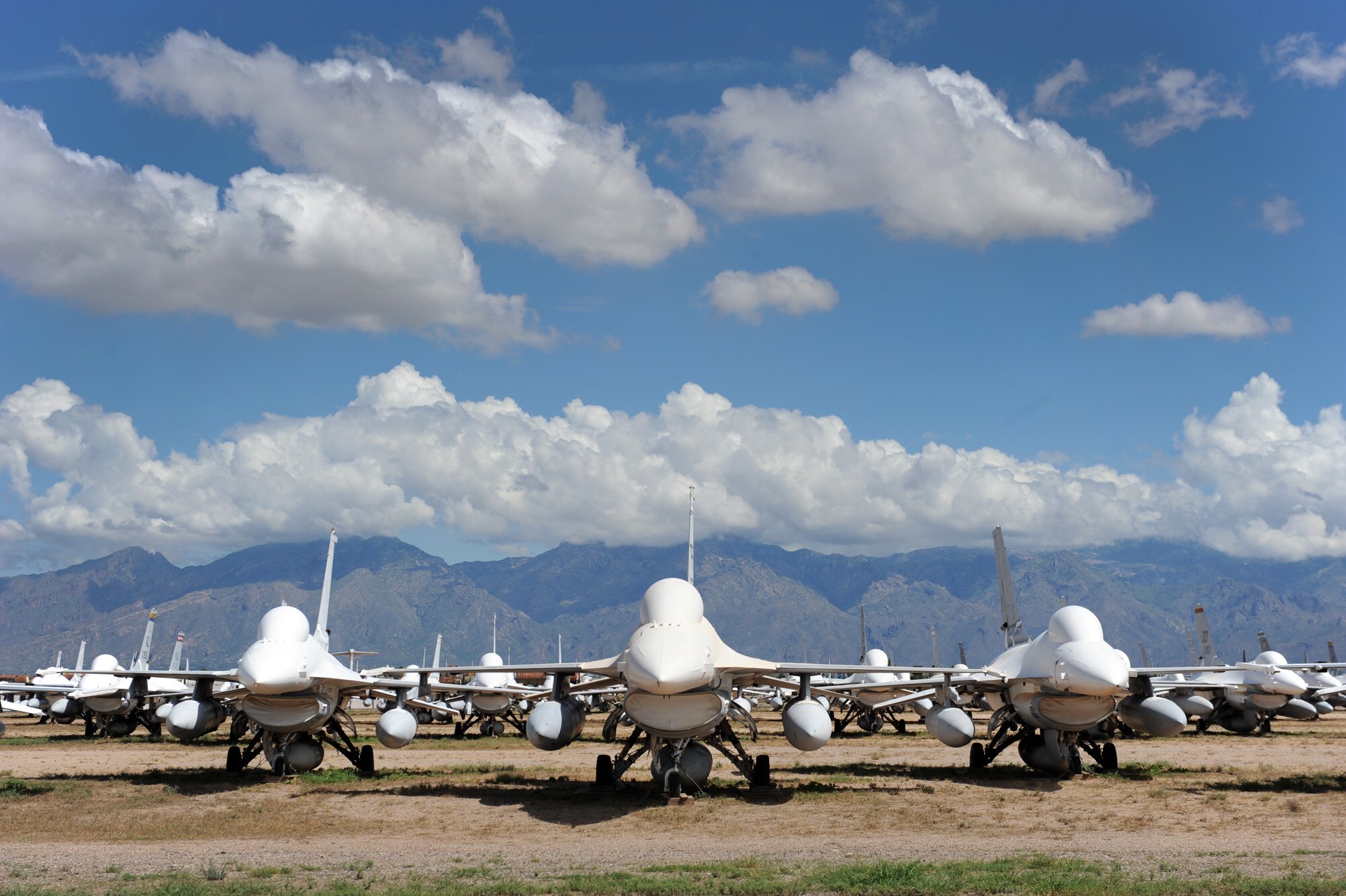 “Mothballed” F-16 Fighting Falcons are parked in the "bone yard" at Davis-Monthan Air Force Base, Ariz. Maintainers from the 309th Aerospace Maintenance and Regeneration Group are regenerating F-16s so they can be converted into usable manned or drone targets allowing Airmen to train and test new weapons platforms.  (U.S. Air Force photo/Staff Sgt. Desiree N. Palacios)