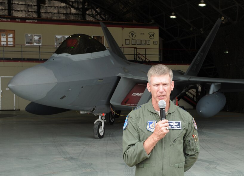 Lt. Gen. Jeffrey A. Remington discusses the importance of the Invincible Spirit exercise during a press conference Jul. 30, 2010 in front of an F-22 Raptor at Osan Air Base, South Korea. General Remington is the 7th Air Force commander. (AFOC photo/Chief Master Sgt. Hong Suk Han)