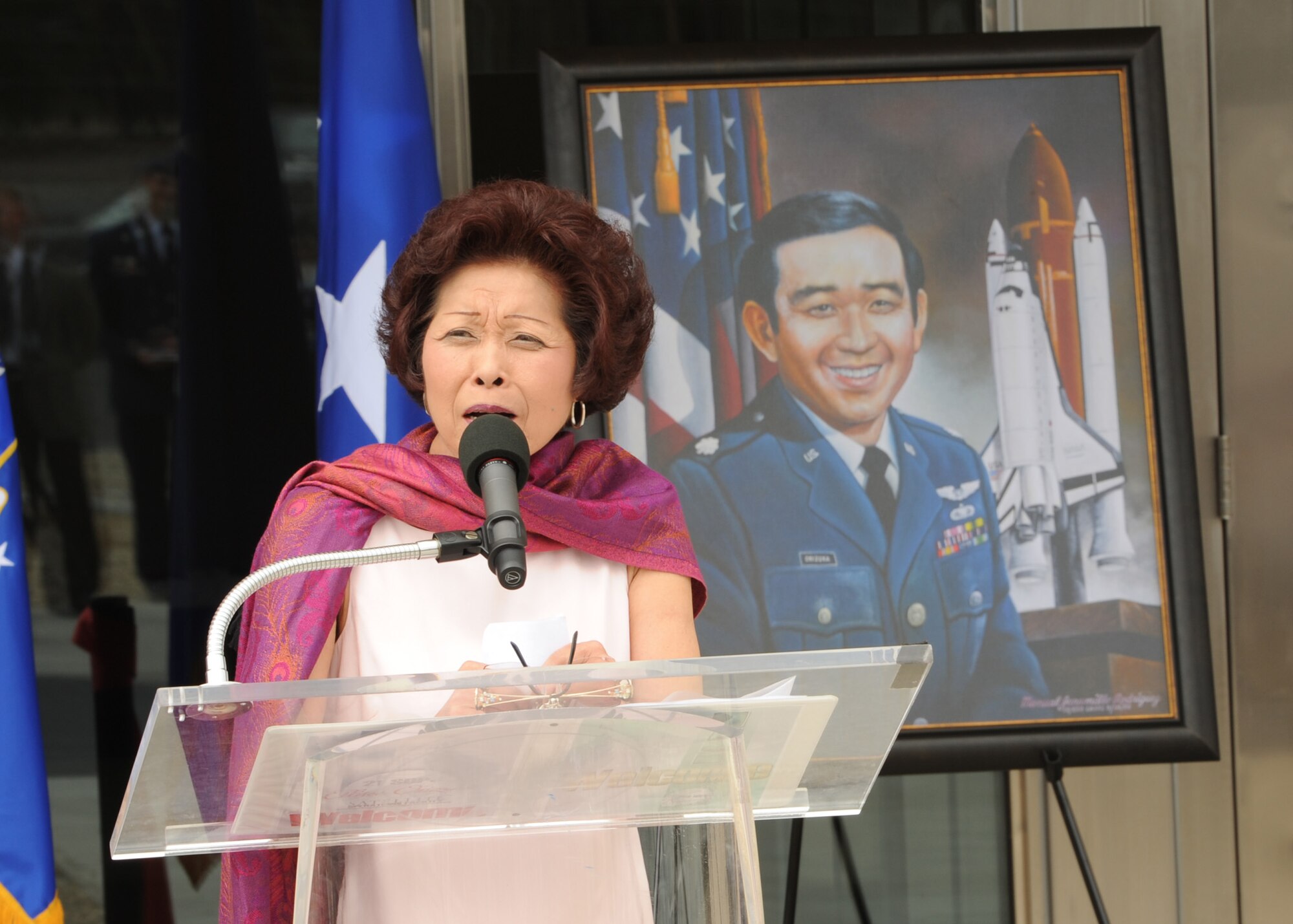 VANDENBERG AFB, Calif.-- Lorna Onizuka, widow of Col. Ellison Onizuka, an astronaut who died aboard Space Shuttle Challenger Jan. 28, 1986, delivers a speech during the Ellison Onizuka Satellite Operations facility dedication ceremony here July 30, 2010. Onizuka Air Force Station, previously located in Sunnyvale, officially closed July 28. The 21st Space Operations Squadron transferred here as part of an effort to consolidate satellite command and control operations while reducing excess infrastructure. Onizuka AFS was selected for closure by the Base Closure and Realignment Commission in 2005 (U.S. Air Force Photo/Senior Airman Bryan Boyette)