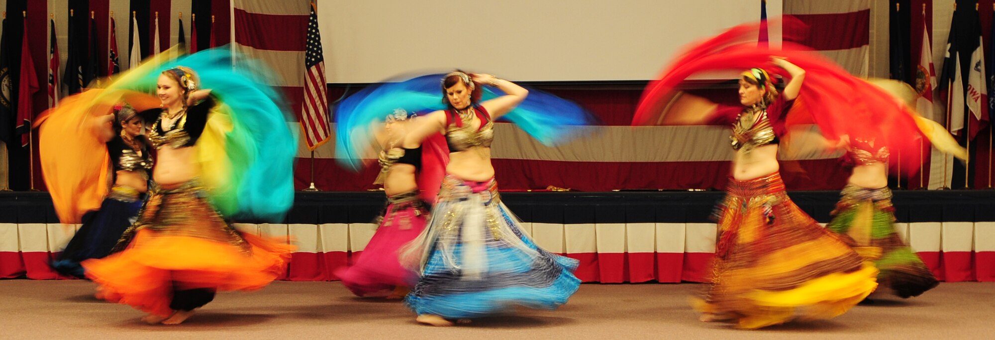 BARKSDALE AIR FORCE BASE, La. – Members of the Port Belly Project, a local belly-dancing group, perform for the Barksdale community during the third annual Multicultural Day event held at Hoban Hall July 30. Other performers included the Red River Pipes and Drums, Gems of Cairo and Native American dancers. (U.S. Air Force photo by Senior Airman Joanna M. Kresge)