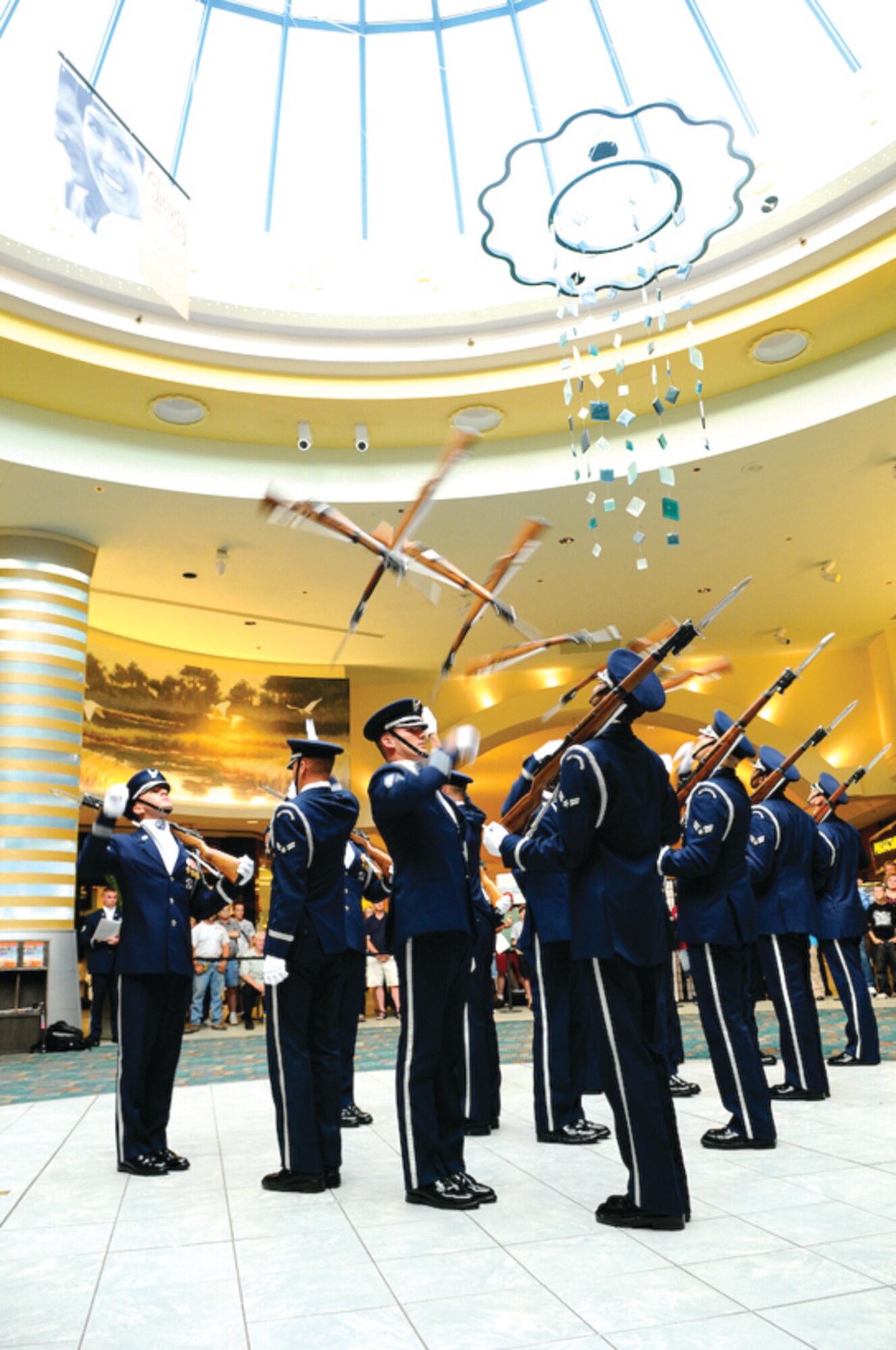 The United States Air Force Honor Guard Drill Team holds a back-to-back performance at a mall in Panama City, Fla., last summer.  The team performs on military installations and in local communities showcasing Air Force professionalism and teamwork.  (U.S. Air Force photo/Senior Airman Alexandre Montes)
