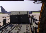 A 71st Airman unloads cargo off the K-loader onto the KC-135 here in late July as part of a joint exercise with the 916th ARW and 4th FW. (USAF photo by Mr. Wayne Wuori, 916 ARW/MXS)