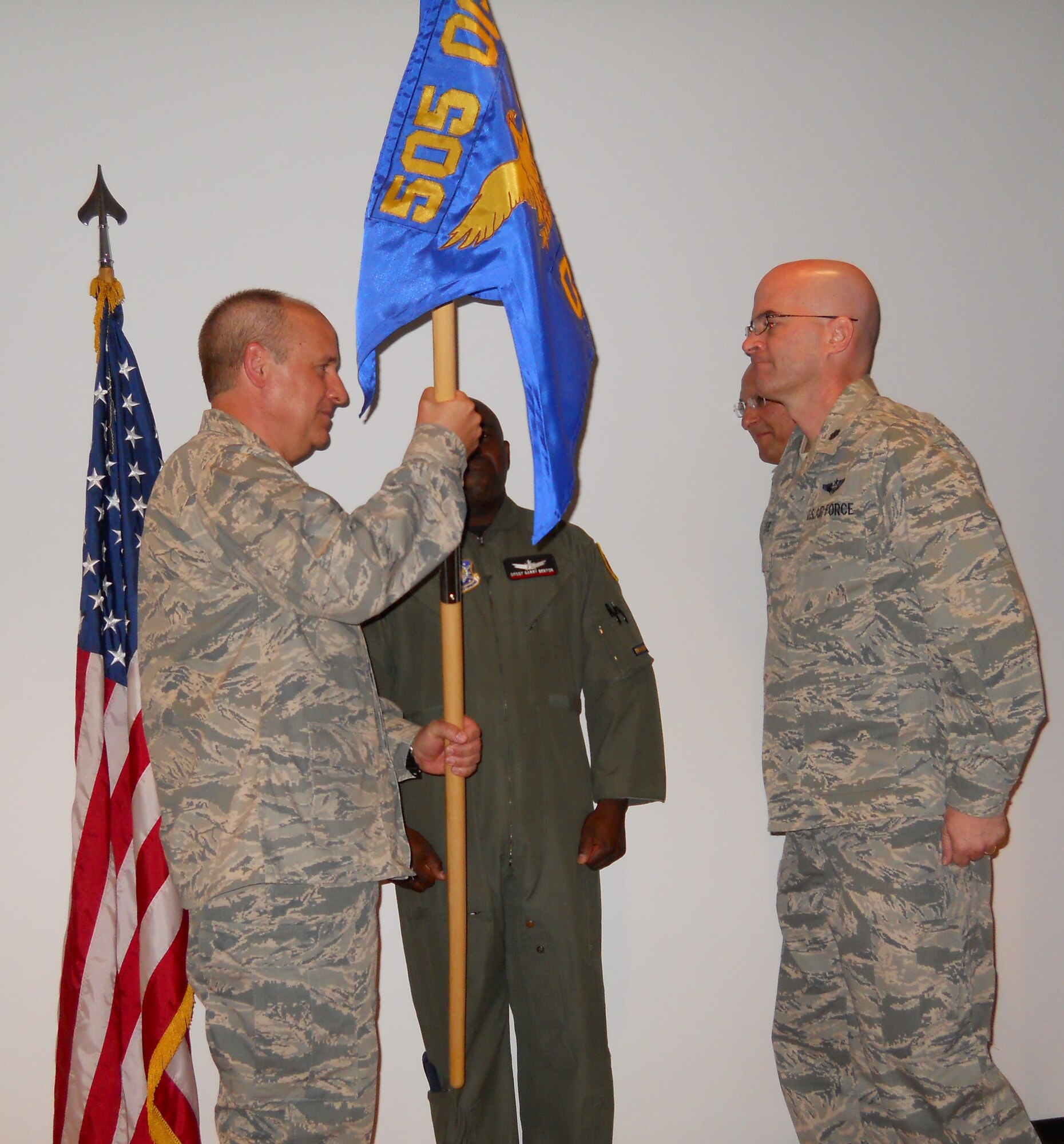 Col. Douglas Anderson (left), 505th Operations Group commander, presents the 505th Operations Squadron guidon to Lt. Col. Michael S. Christie during a change of command ceremony June 3 at Nellis Air Force Base, Nev. Colonel Christie was serving as the U.S. Central Command Operations Director executive officer and assumed command from Lt. Col. William Apodaca. The 505th OS operates the Combined Air and Space Operations Center-Nellis. The squadron conducts initial and advanced qualification training for air, space, cyber and information operations and develops tactics, techniques and procedures to assess and integrate irregular warfare activities into joint operations. The 505th OG and OS are subordinate units of the 505th Command and Control Wing, Hurlburt Field, Fla. The 505th CCW's mission is to improve Warfighter capability through command and control testing, tactics development and training. (U.S. Air Force photo)
