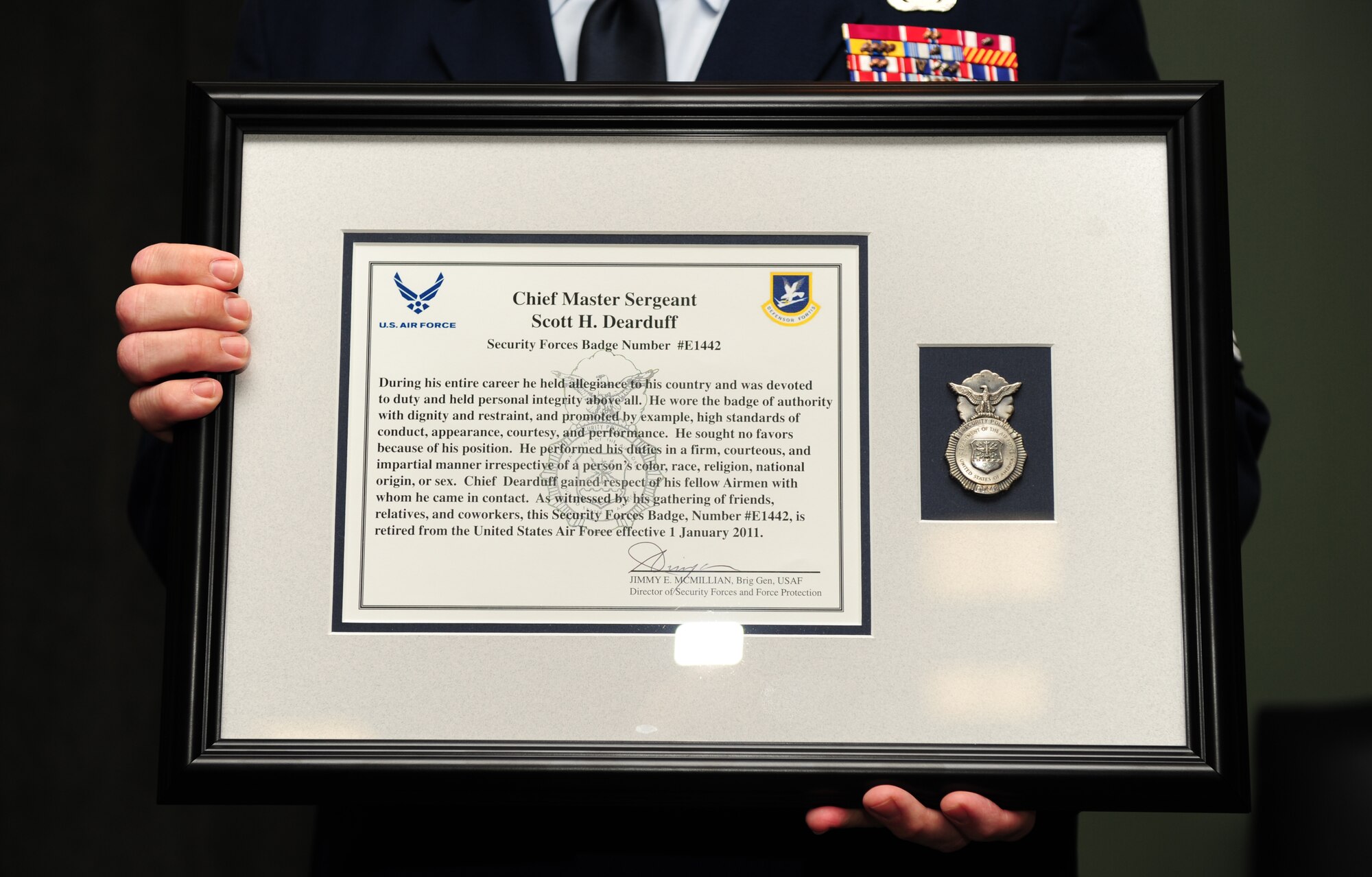 100723-F-6838W-020
SHAW AIR FORCE BASE, S.C. -- Chief Master Sgt. Scott Dearduff, 9th Air Force Command Chief holds his plaque containing his security forces badge, July 23, 2010. Chief Dearduff put in over 28 years of service to the Air Force. Due to his high standards of conduct, courtesy and performance in his duties, the security forces badge number E1442 which he wore for years was retired from the Air Force, effective Jan. 1, 2011. (U.S. Air Force photo/Airman 1st Class Neil D. Warner)