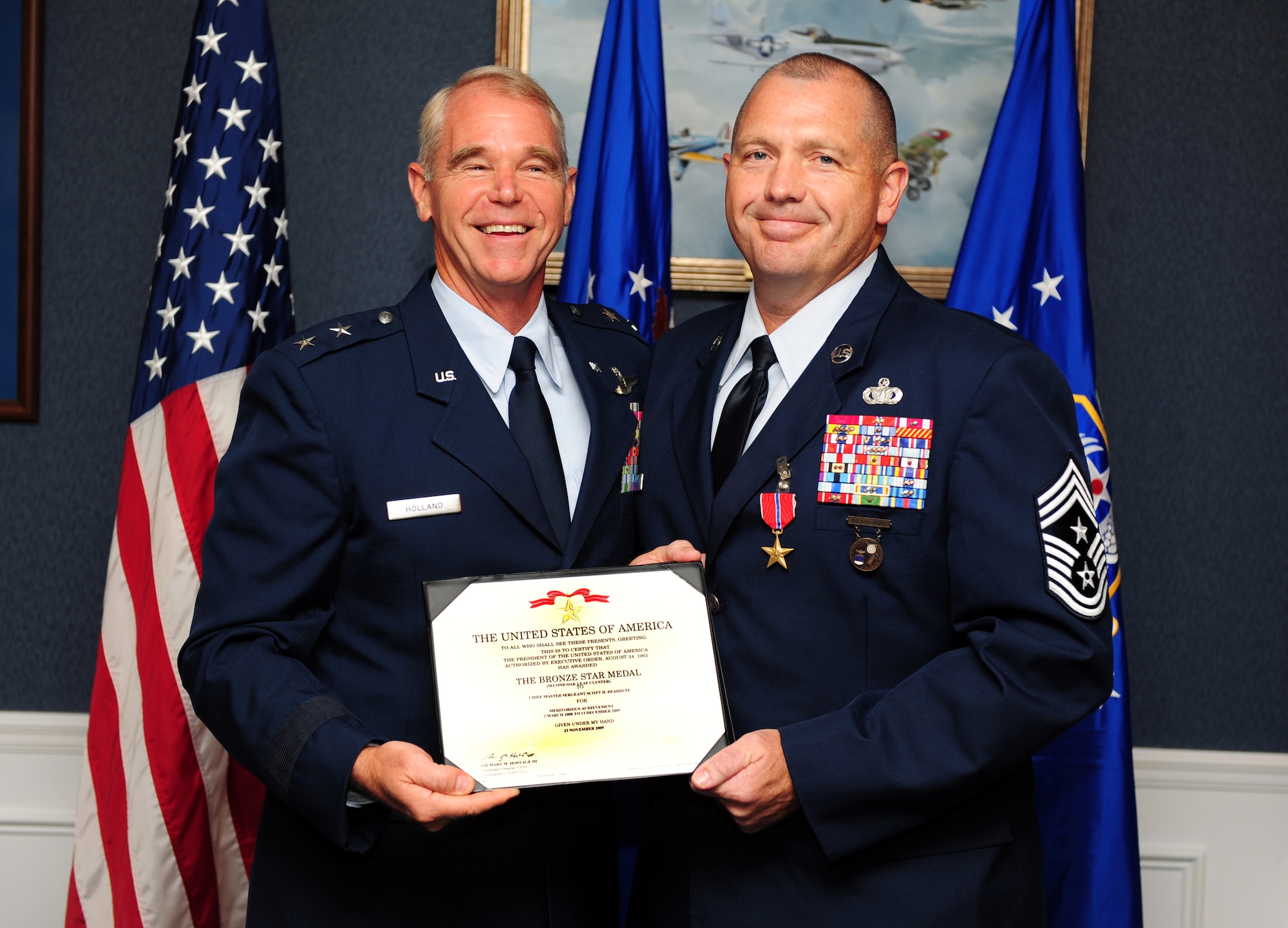 100723-F-6838W-002
SHAW AIR FORCE BASE, S.C. -- Chief Master Sgt. Scott Dearduff, 9th Air Force Command Chief accepts his Bronze Star medal from Maj. Gen. William Holland, 9th AF commander, July 23, 2010. Chief Dearduff put in over 28 years of service to the Air Force. Due to his high standards of conduct, courtesy and performance in his duties, the security forces badge number E1442 which he wore for years was retired from the Air Force, effective Jan. 1, 2011. (U.S. Air Force photo/Airman 1st Class Neil D. Warner)
