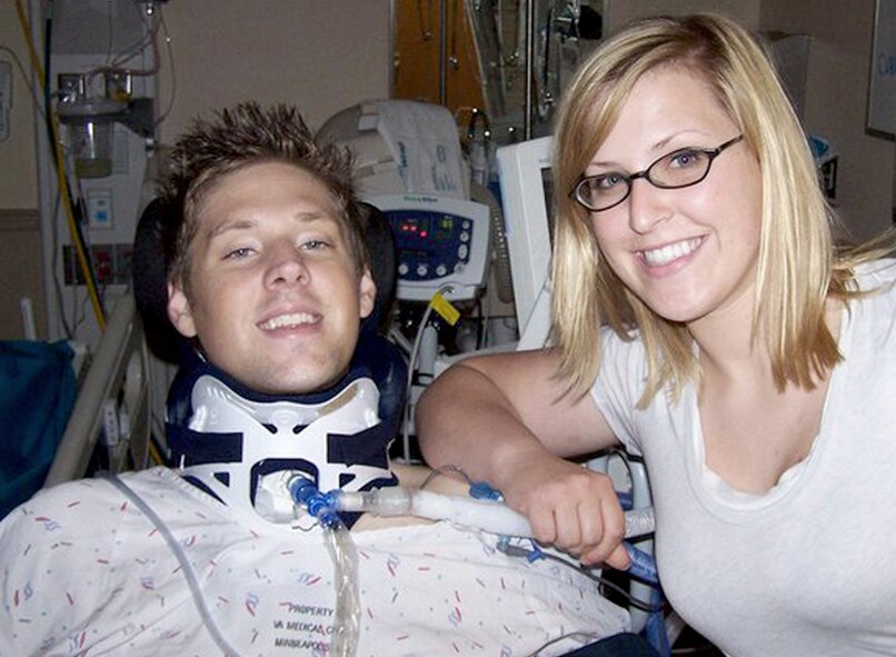 Senior Airman Emerald Ralston sits with Army Sgt. Ian Ralston, her brother, at the Veterans Affairs Spinal Cord Injury Center in Minneapolis, Minn. Airman Ralston is a public affairs specialist with the 92nd Air Refueling Wing Public Affairs. (Courtesy photo)