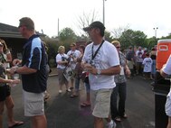 Members of the 916th Air Refueling Wing proceed to the tent for the pre-party with Tim McGraw as part of the Get One Now program. (USAF photo by Ms. Donna Lea, 916ARW/PA)