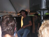 Tim McGraw sings a couple of his songs to Air Force reservists during the pre-party for the Get One Now program on July 24. (USAF photo by Ms. Donna Lea, 916ARW/PA)