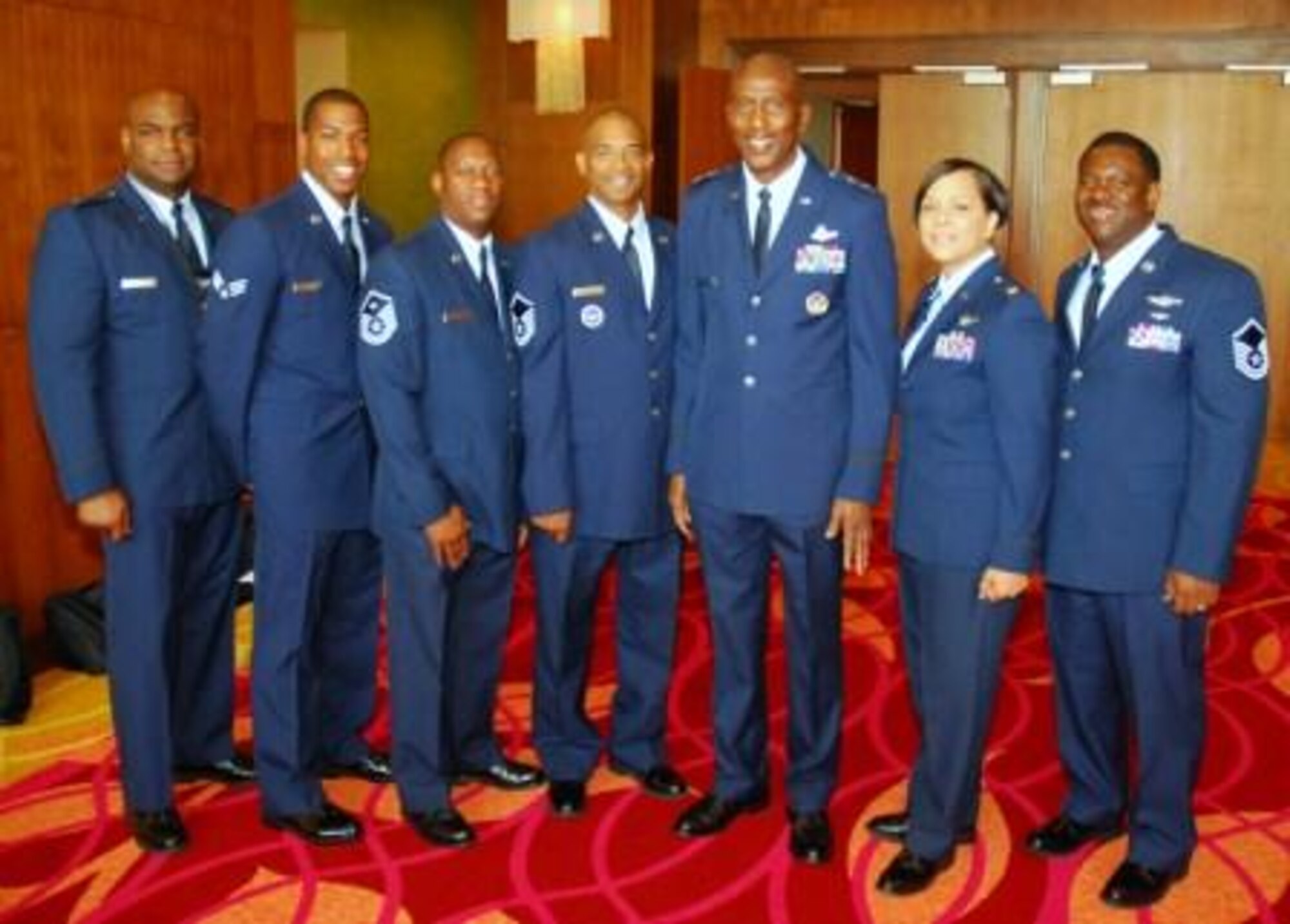 Maj. Gen. Harold "Mitch" Mitchell, Deputy Inspector General of the Air Force, poses with Dobbins personnel at the Tuskegee Airmen Conference in San Antonio. Servicemembers are learning valuable leadership tools and how overcoming diversity allows the Air Force to accomplish its mission. These members will take the information they learned and share it with their home unit. (U.S. Air Force photo/ Staff Sgt. Shaun Shenk)