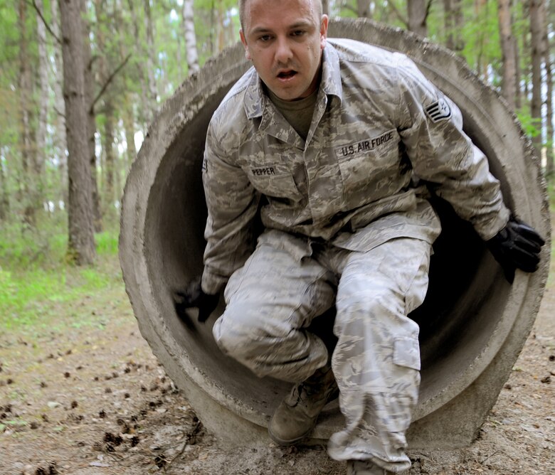 Staff Sgt. Robert Pepper completes an obstacle July 23, 2010 during Exercise Allied Strike 10, at the U.S. Army's training area in Grafenwoehr, Germany.  Allied Strike is Europe's premier close air support that helps build partnership capacity among NATO nations. (U.S. Air Force photo/Senior Airman Caleb Pierce)
