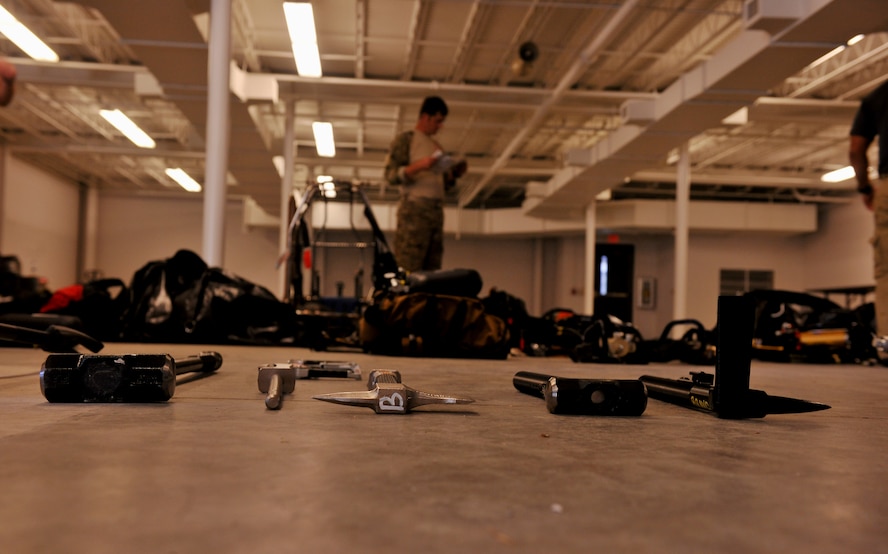 VALDOSTA, Ga. -- Excavation tools are laid out in preparation for a confined spaces exercise at a local junkyard here July 27. Members of the 38th Rescue Squadron from Moody Air Force Base, Ga., conducted training on the tools they will be using during rescue efforts in confined spaces. (U.S. Air Force photo by Airman 1st Class Joshua Green/RELEASED)