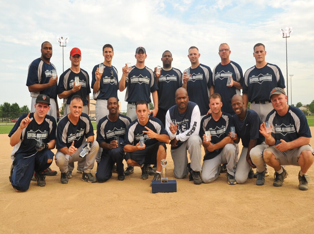 The 113th Wing Softball team pose for a victory photo after winning the Base Softball League Championship July 21. The 113 Wing seized the championship 8 to 7 against 1st HS. (U.S. Air Force photo/ Bobby Jones)