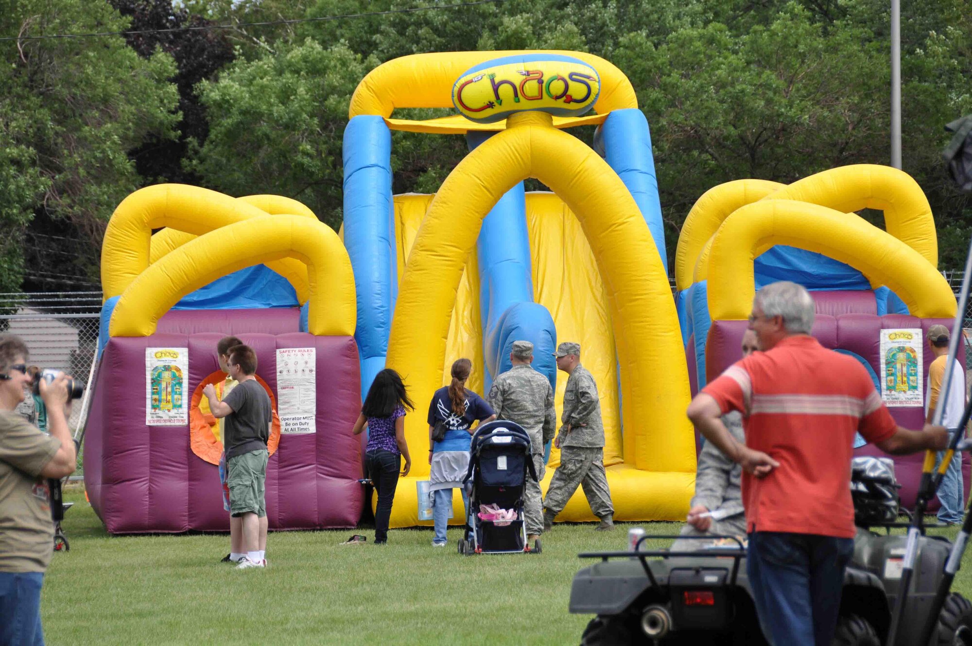Inflatable play areas dominated the landscape at the sports field during the 934th Airlift Wing Family Day July 11.  More than 2,200  people attended the event which featured, food, information booths, games, crafts and a car show.  (Air Force photo/Master Sgt. Kerry Bartlett)