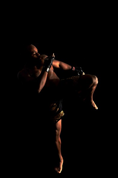 MOODY AIR FORCE BASE, Ga. -- Staff Sgt. Clint Williams, 23rd Maintenance Operations Squadron production manager, demonstrates the kick that gained him the Georgia record for quickest knockout here July 29. “Some of the guys I am training and mentoring are high school wrestlers who take techniques back and apply it when they compete there,” said Sergeant Williams. “It’s beneficial for them to have a positive role model.” (U.S. Air Force photo by Airman 1st Class Joshua Green/RELEASED)