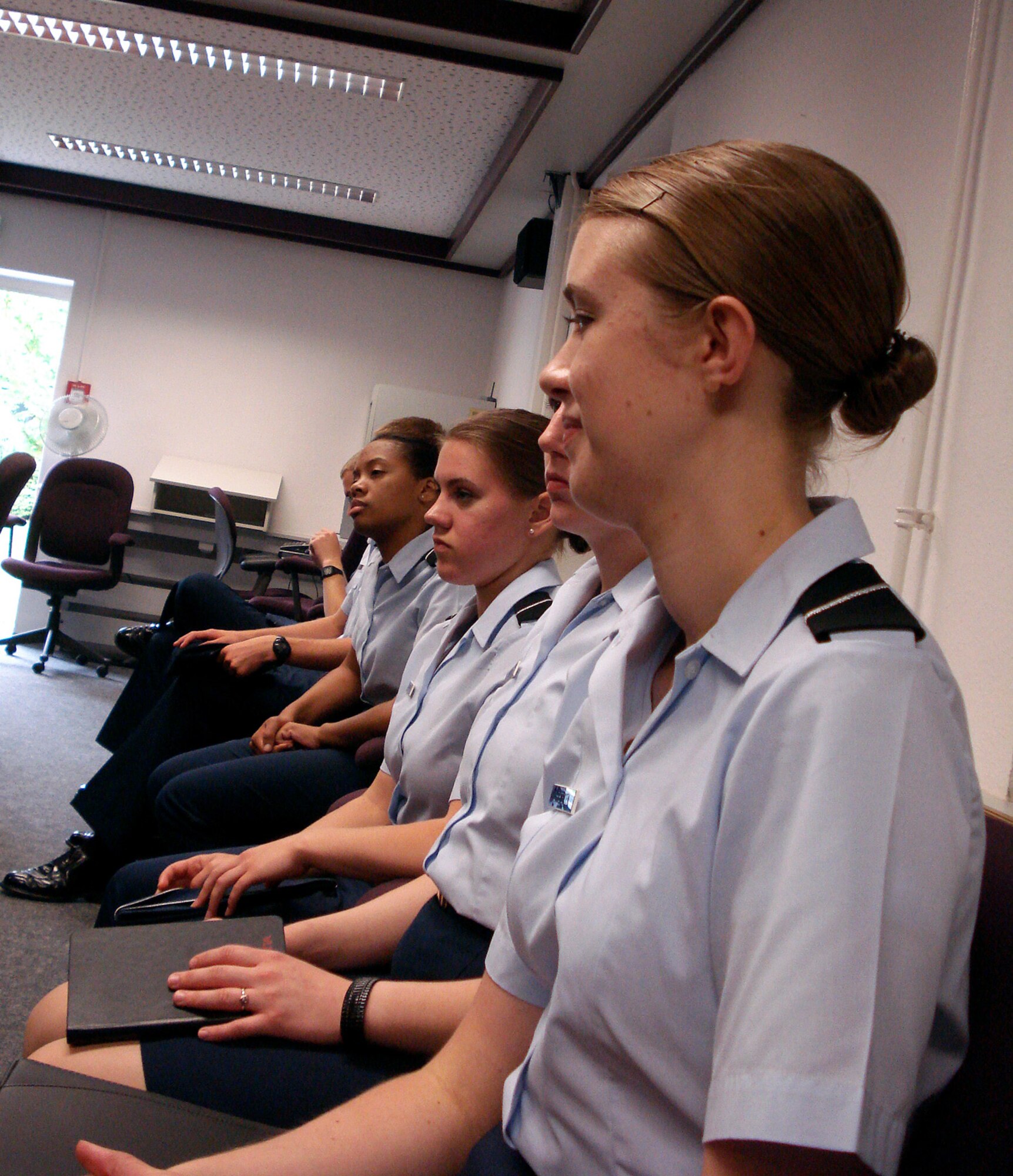 SPANGDAHLEM AIR BASE, Germany- Cadet Danielle Christensen, a sophomore cadet from the University of Portland, Detachment 695, along with Cadet Adrian Buttenhoff, a sophomore cadet from the University of Georgia, Detachment 160, and sophomore Cadet Brianca Langham from Tennessee State University, Detachment 790, listen to an informational briefing about NATO operations during a visit to Geilenkirchen Air Base, Germany. The AFROTC students visited the NATO base July 26 to meet with company grade officers from NATO countries including Canada, Germany and Denmark. (U.S. Air Force photo/ Cadet Katherine O’Connor)