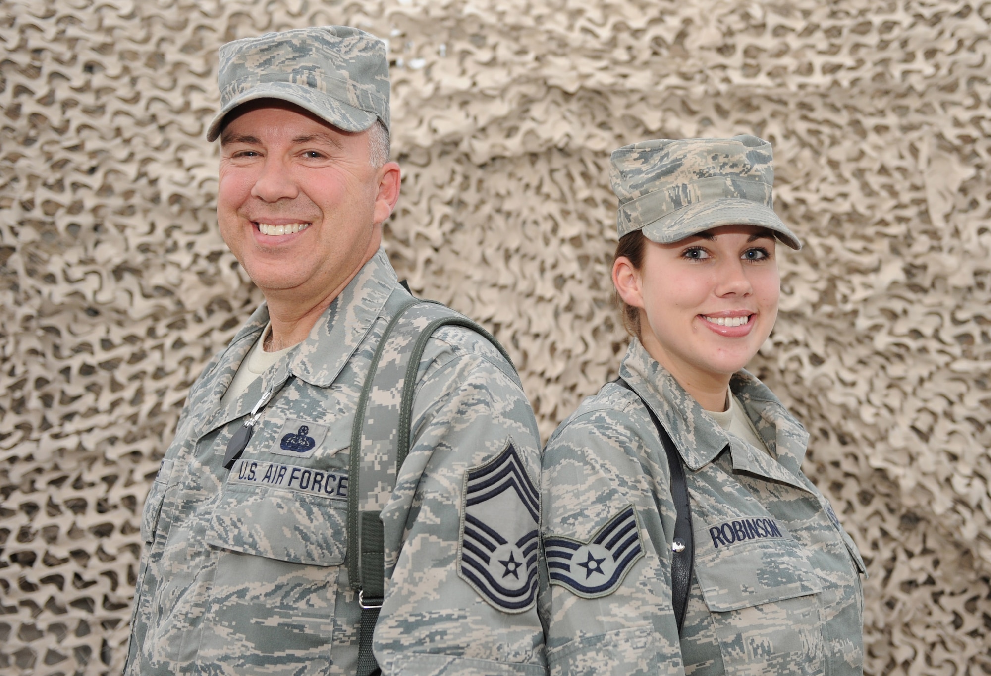 Chief Master Sgt. David G. Hayes, and his daughter, Staff. Sgt. Ashley Robinson, are both deployed to the 451st Air Expeditionary Wing at Kandahar Airfield, Afghanistan. (U.S. Air Force photo by Staff Sgt. Chad Chisholm)