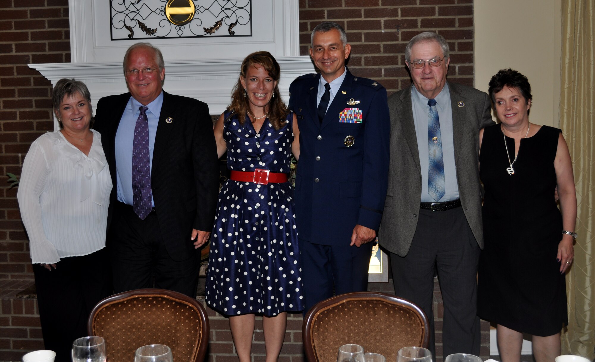 Then 14th Flying Training Wing Commander Col. Roger Watkins and his wife 
Leslie pose with his Wingman Award recipients Mike Hainsey and his spouse 
Brenda (left) and Paul Swain and his guest Linda McKenzie (right) after the Wingman Dinner Monday night at the Columbus Club. (U.S. Air Force Photo/Sonic 
Johnson)