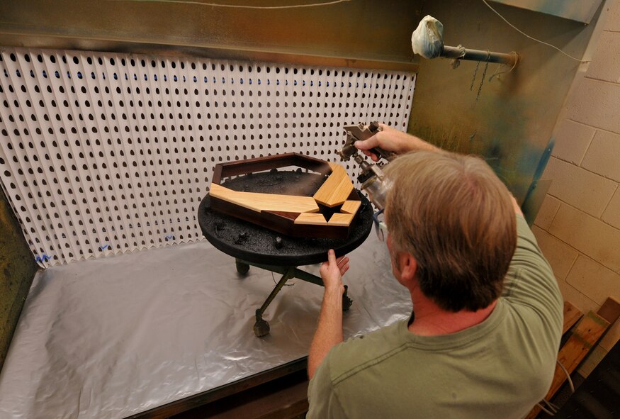 MOODY AIR FORCE BASE, Ga. -- Jim Connelly, Wood Shop supervisor, applies a gloss coat finish to a shadow box here July 9. The coat is an applied at least twice to give the shadow box a look of perfection. (U.S. Air Force photo by Airman Class Joshua Green/RELEASED)