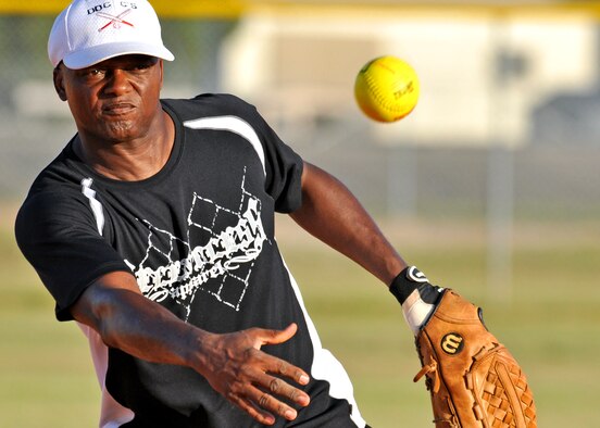 Terry “T.P.” Perkins, 96th Logistics Readiness Squadron, pitches for his team during an intramural softball playoff game July 28 at Eglin’s Foster Stadium.  LRS advanced to meet the 96th Medical Group in the base championship Aug. 2.  (U.S. Air Force photo/Tech Sgt. Cheryl Foster.)  
