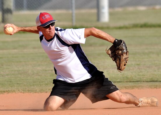 Jay Wright, shortstop for 96th Logistics Readiness Squadron team, sends the throw over to first during an intramural softball playoff game July 28 at Eglin’s Foster Stadium.  The 46th fell to the 96th Logistics Readiness Squadron, 8-3, who advanced to the championship game Aug. 2.  (U.S. Air Force photo/Tech Sgt. Cheryl Foster.)  