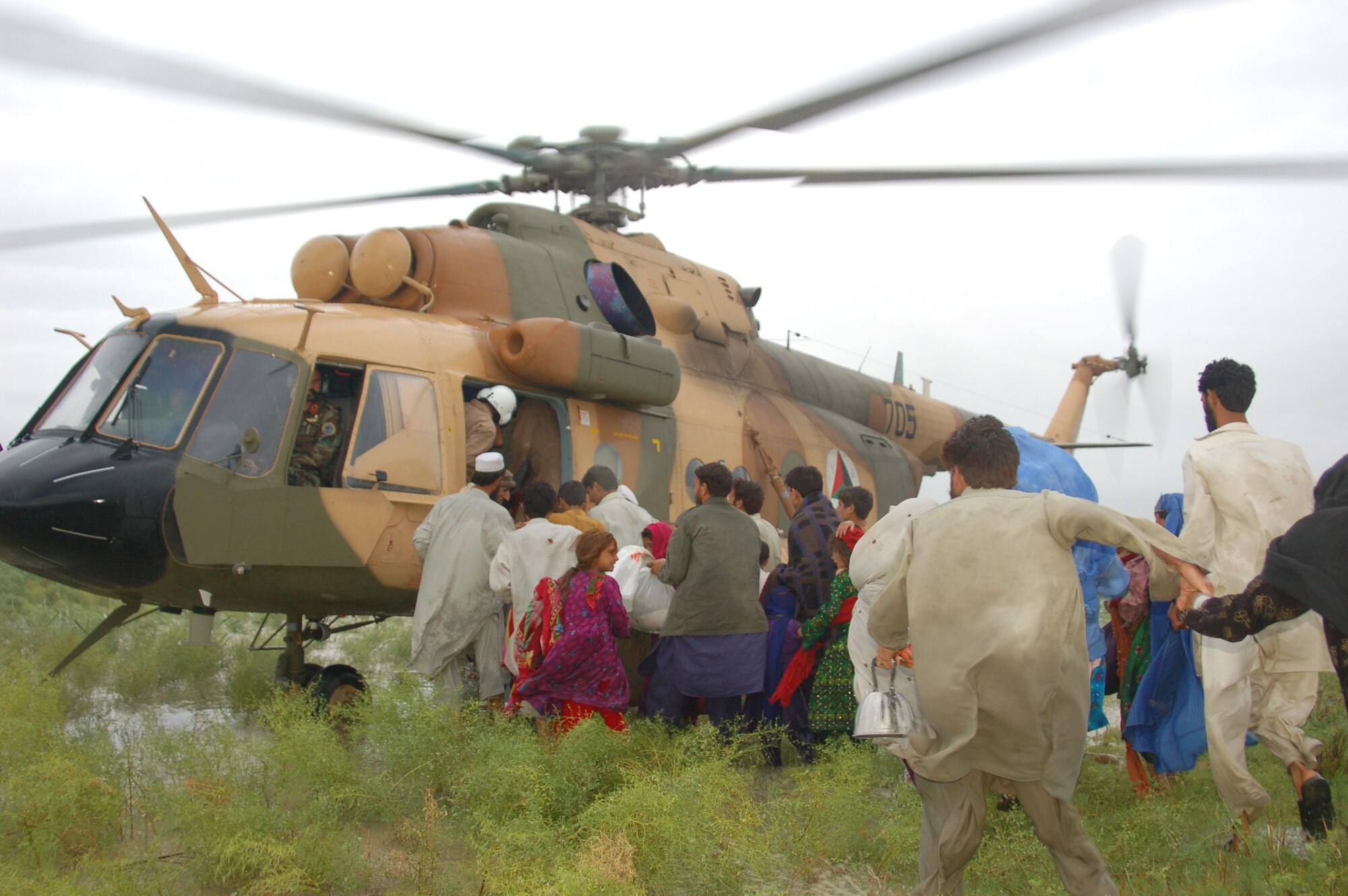 On July 28-29, 2010 the Afghan Air Force responded with two Mi-17s and aircrew accompanied by United States Air Force Air Advisors to an urgent request to begin rescuing people overcome by rapidly rising flood waters at the confluence of the Kabul and Laghman Rivers, about 11 miles west of Jalalabad.  Over 2,100 people were saved, by the AAF and their Mi-17s from the high threat raging flood waters most of them under the threat of foreign insurgent fighters.  (Courtesy photo by Maj. Kazim, Afghan Air Force/RELEASED).