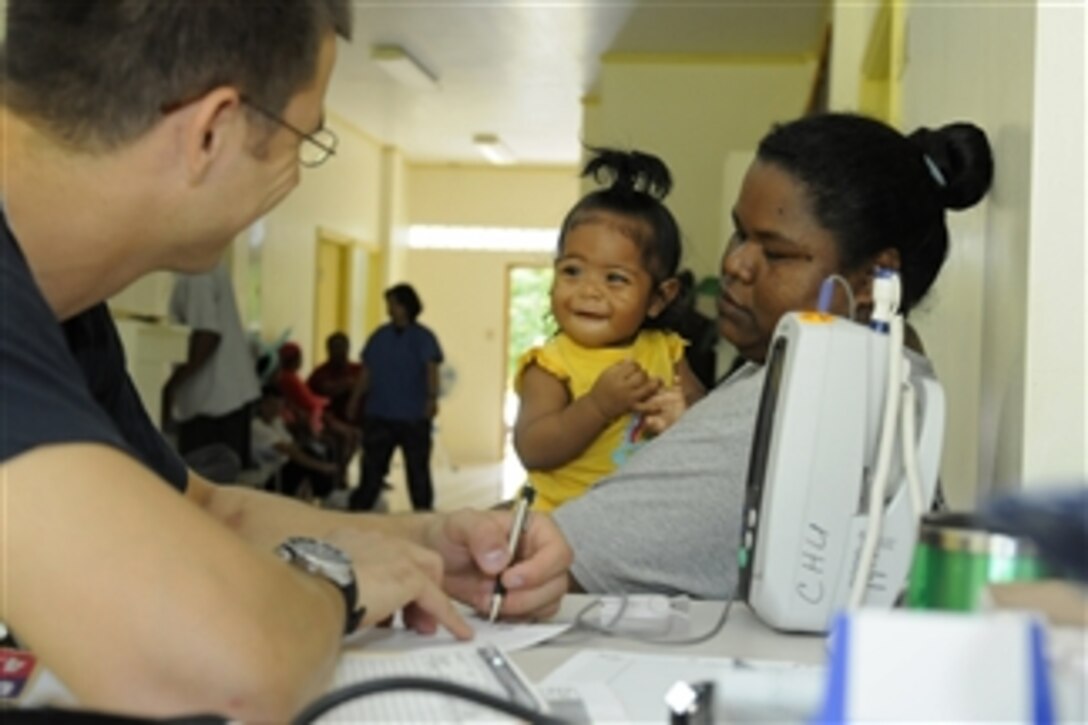 U.S. Navy Ensign Neil Petersen, assigned to U.S. Naval Hospital Guam, records vitals for a toddler patient at the Southern Community Health Center on the island of Peleliu, Palau, on July 28, 2010.  The U.S. 7th Fleet command ship USS Blue Ridge (LCC 19) was in the country to conduct Pacific Partnership 2010, the fifth in a series of annual U.S. Pacific Fleet endeavors aimed at strengthening regional relationships with host nations and partner nations.  