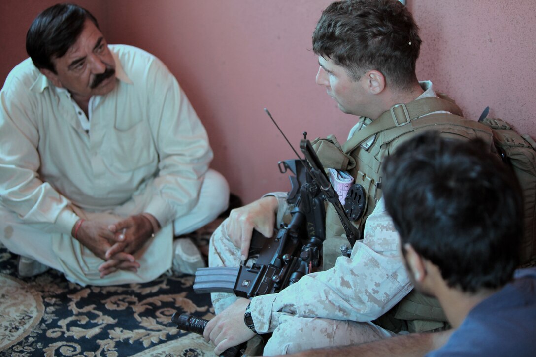 2nd Lt. Ben Howarth, 2nd Platoon commander, Company L, 3rd Battalion, 25th Marine Regiment, listens to an Afghan village elder portrayed by a role player during a training mission at Camp Pendleton, Calif., July 30, 2010.  3rd Battalion utilized Afghan role players in a majority of their training exercises during their four month predeployment training at Camp Pendleton.