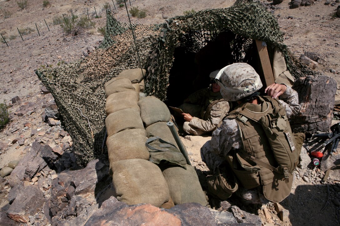 Sgt. Maj. Angela Maness, battalion sergeant major for Combat Logistics Battalion 3 (reinforced), Combat Logistics Regiment 3, 3rd Marine Logistics Group, III Marine Expeditionary Force, checks on the Marines as they provide security over the Combat Logistics Support Area, July 31 at The Marine Corps Air-Ground Combat Center, Twentynine Palms, Calif. The Marines from Engineer Company built the CLSA as a part of the General Engineering Exercise to prepare for the final exercise.