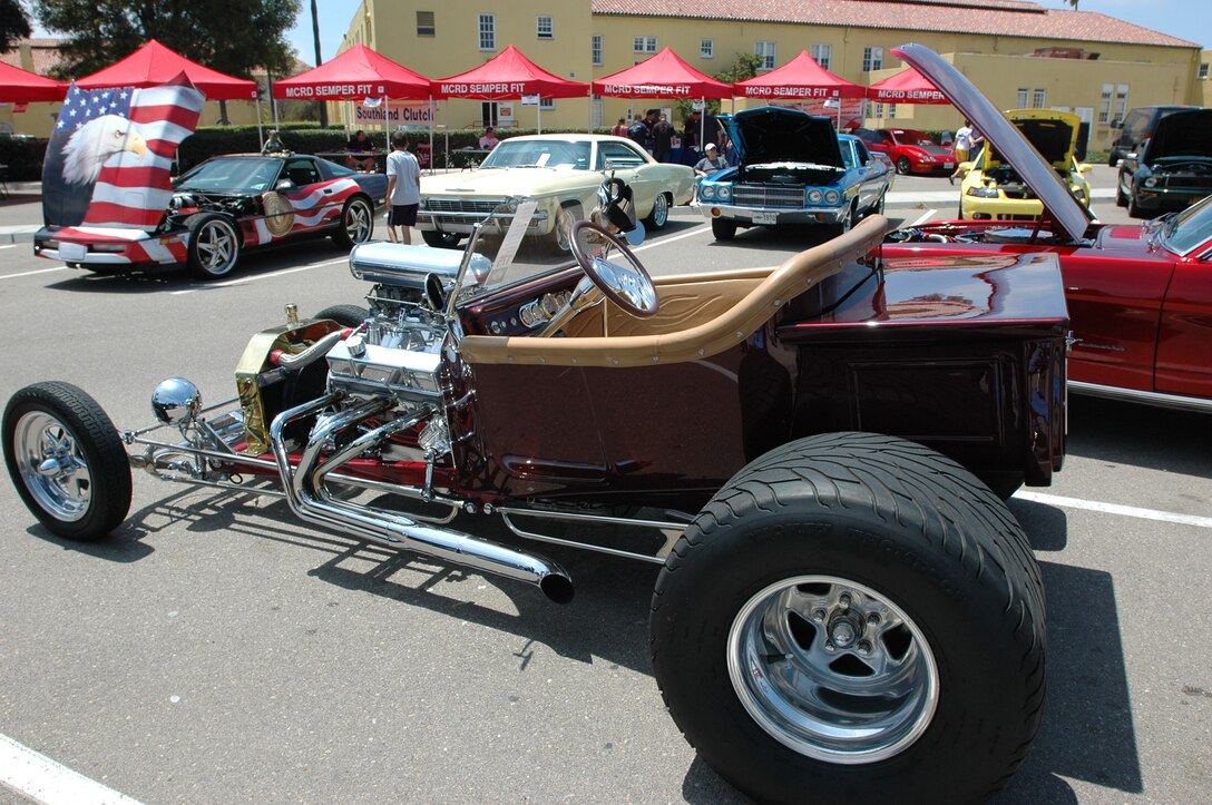 A 1923 T-Bucket Roadster sits in the sun on the pavement by the Fitness Center during the 7th Annual Car and Motorcycle show here, July 31.