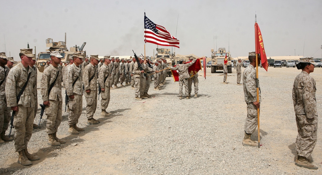 First Sgt. Raquel Painter, the battalion sergeant major of Combat Logistics Battalion 6, 1st Marine Logistics Group (Forward) and Maj. William Stophel, commanding officer, CLB-6, 1st MLG (FWD), retire the battalion colors during the transfer of authority with CLB-2, 1st MLG (FWD), July 31. “The Red Cloud Battalion” has spent the last seven months providing logistical support to Regimental Combat Team 2 in areas to include Sangin, Musa Qal’eh and Now Zad, providing everything from food and fuel to ammunition.