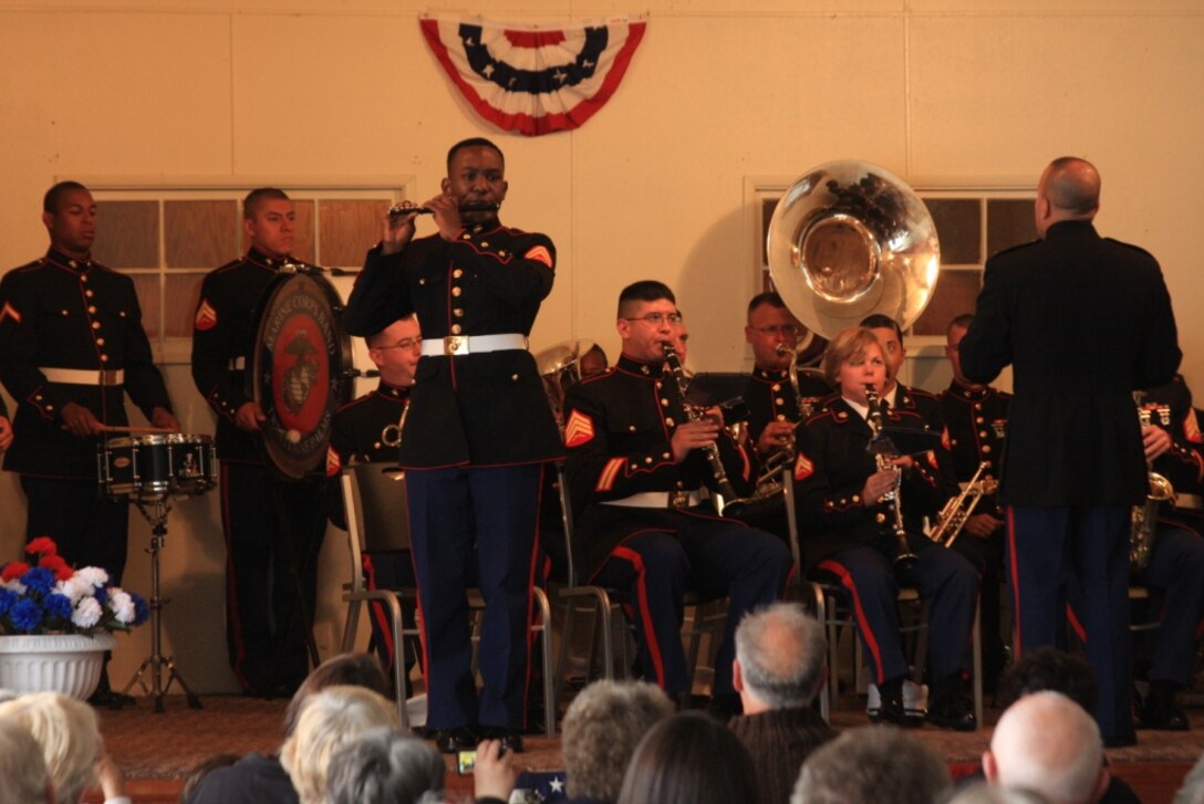 Corporal Darnell Haynes, a piccolo player in the Combat Center Band, performs a solo during a performance Winchester Community Center June 1.