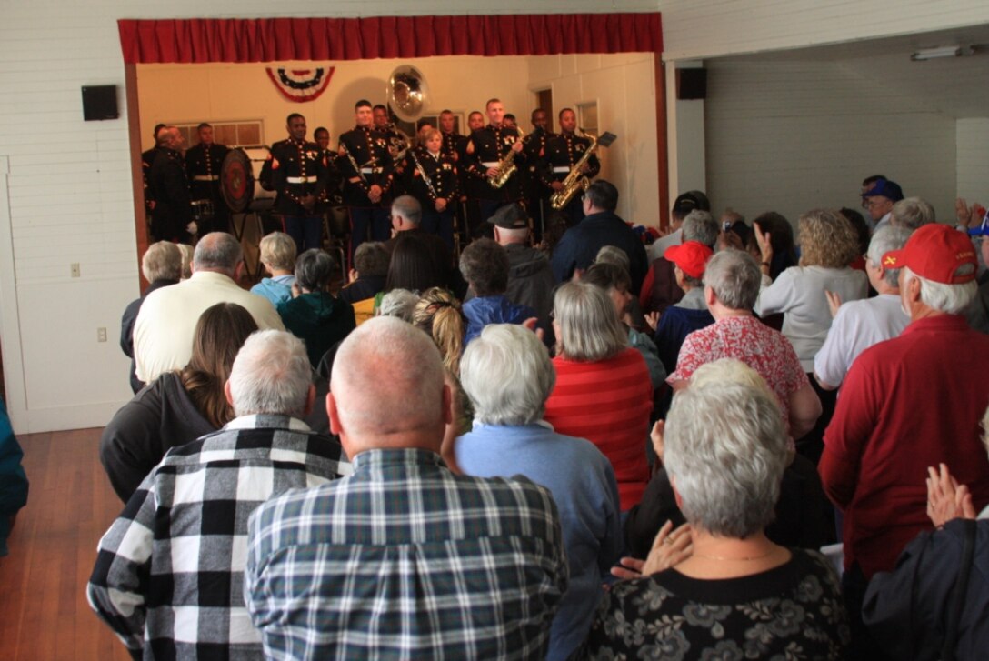 Twenty-one members of the Combat Center Band receive a standing ovation from the Reedsport/Winchester Bay residents during a concert at the Winchester Community Center June 1 as a part of the band’s annual Memorial Day weekend band trip.