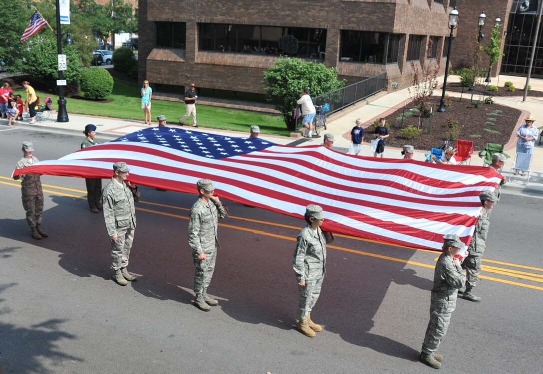 Memorial Day, originally called Decoration Day, is a day of remembrance for those who have died in our nation's service.  The 932nd Airlift Wing takes time out each year to march the American flag in the memory of those lost.  They marched through the streets of Belleville, Ill.  (U.S. Air Force photo submitted by Tech. Sgt. Chris Parr)