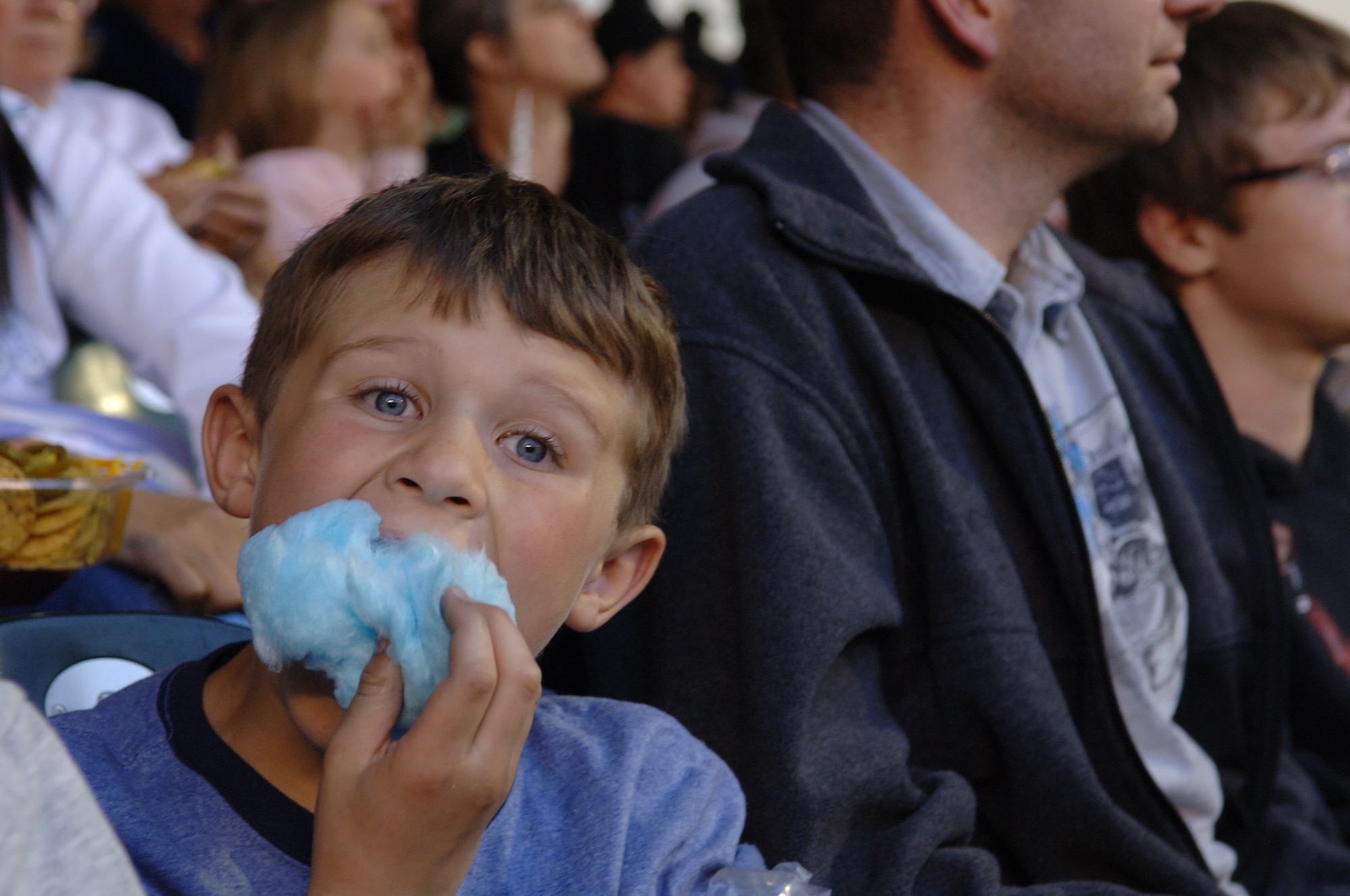ELLSWORTH AIR FORCE BASE, S.D. - The son of Brad Sudbeck, 28th Civil Engineering Squadron contract developer, enjoys a handful of cotton candy during a trip to a Colorado Rockies baseball game, May 29. The trip was one of many events organized and hosted  by Outdoor Recreation. (U.S. Air Force photo/Airman 1st Class Jarad A. Denton)
