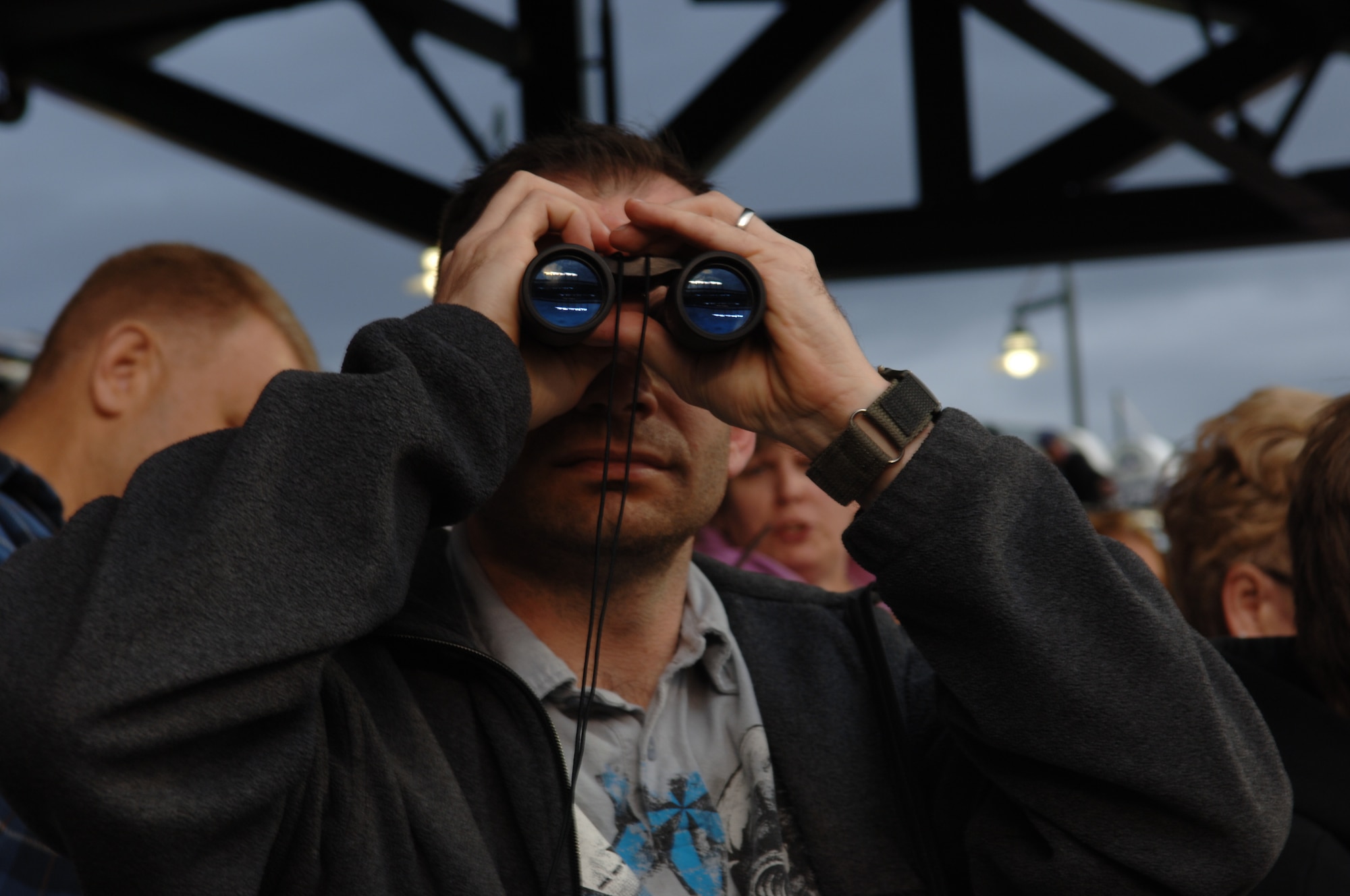 ELLSWORTH AIR FORCE BASE, S.D. - Master Sgt. Richard Platt, 28th Force Support Squadron first sergeant watches a Colorado Rockies baseball game through binoculars, May 29. Sergeant Platt was part of a group who attended the game as part of an Outdoor Recreation hosted activity.(U.S. Air Force photo/Airman 1st Class Jarad A. Denton)
