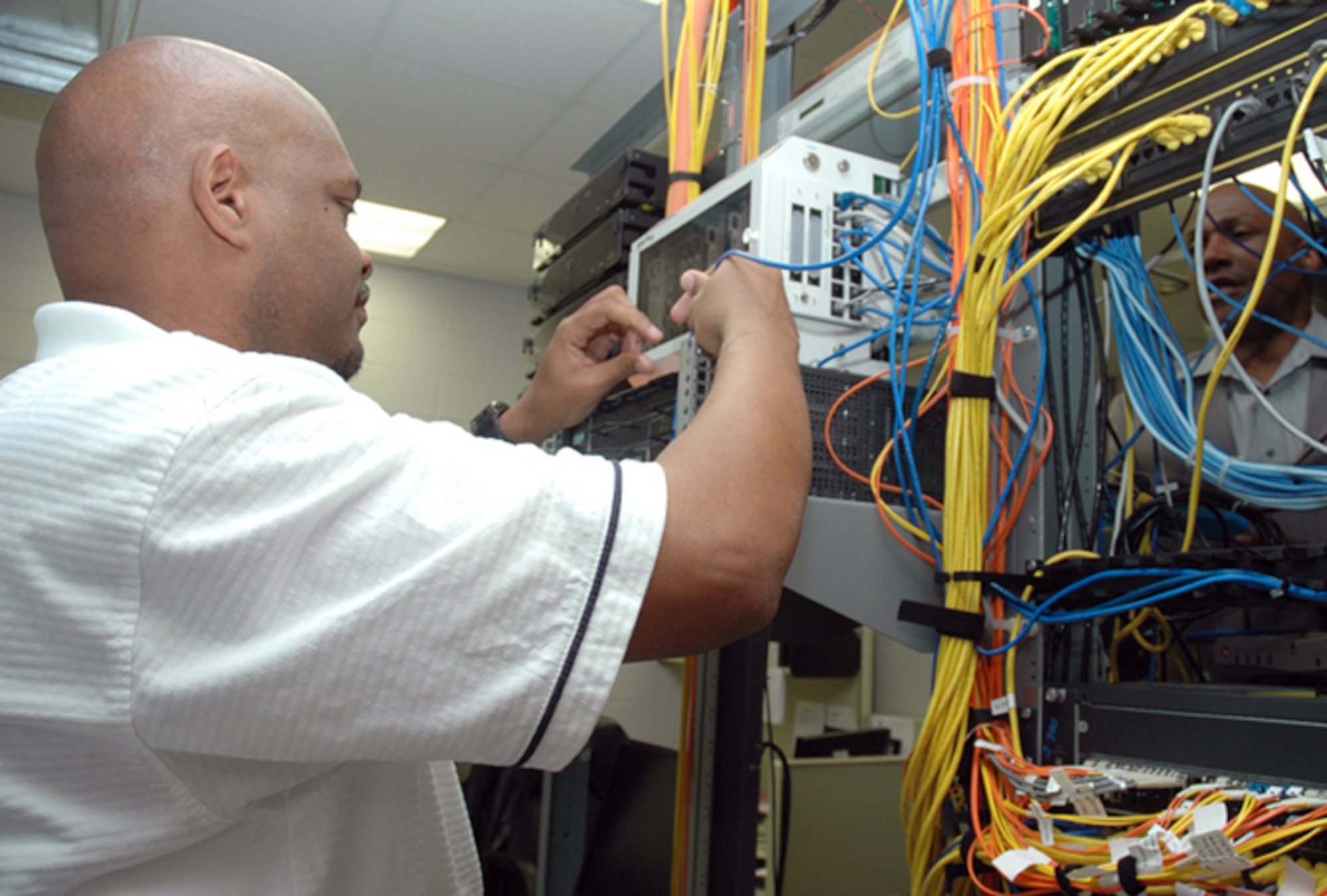 Gary O. Hanson, telephone switch technician, 94th Communications Flight, maintains the 10,000 line telephone switch at Dobbins Air Reserve Base. He makes sure dial tone, voicemail and all other phone services are provided to all Dobbins employees. (U.S. Air Force photo/Travon Dennis)
