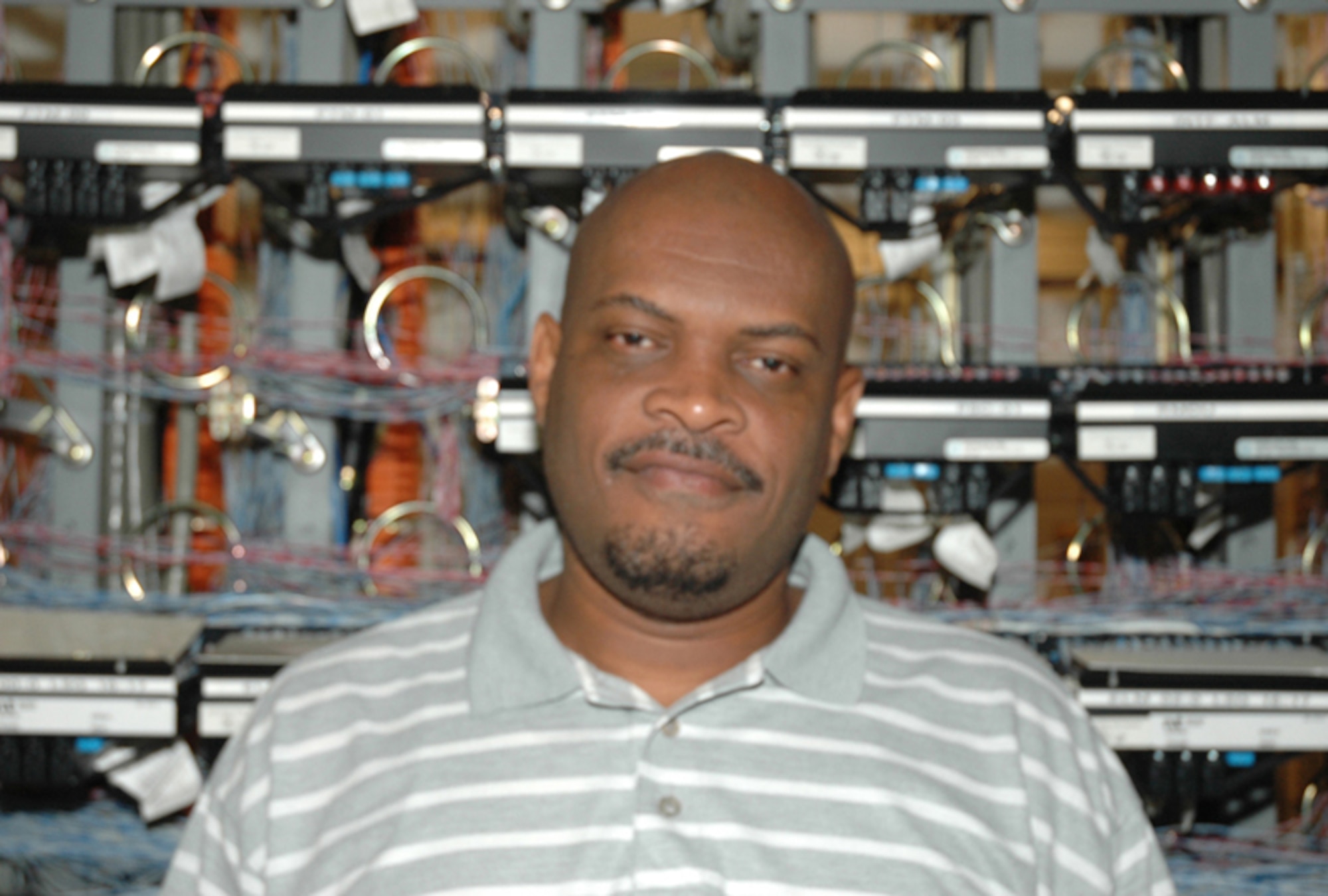 Gary O. Hanson, telephone switch technician, 94th Communications Flight, maintains the 10,000 line telephone switch at Dobbins Air Reserve Base. He makes sure dial tone, voicemail and all other phone services are provided to all Dobbins employees. (U.S. Air Force photo/Travon Dennis)
