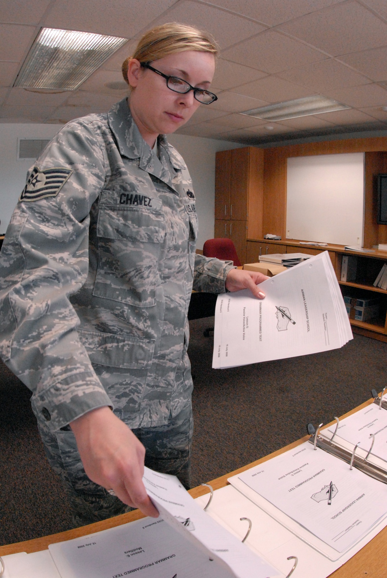 Tech.  Sgt. Jasmine Chavez, an instructor from the Dyess AFB, TX Airman Leadership School, builds student books for the start of the first class of the Goodfellow ALS, June 1.  Tech. Sgt Chavez is on temporary duty to Goodfellow assisting the first class starting June 2. (U.S. Air Force photo/ Master Sgt. Randy Mallard)