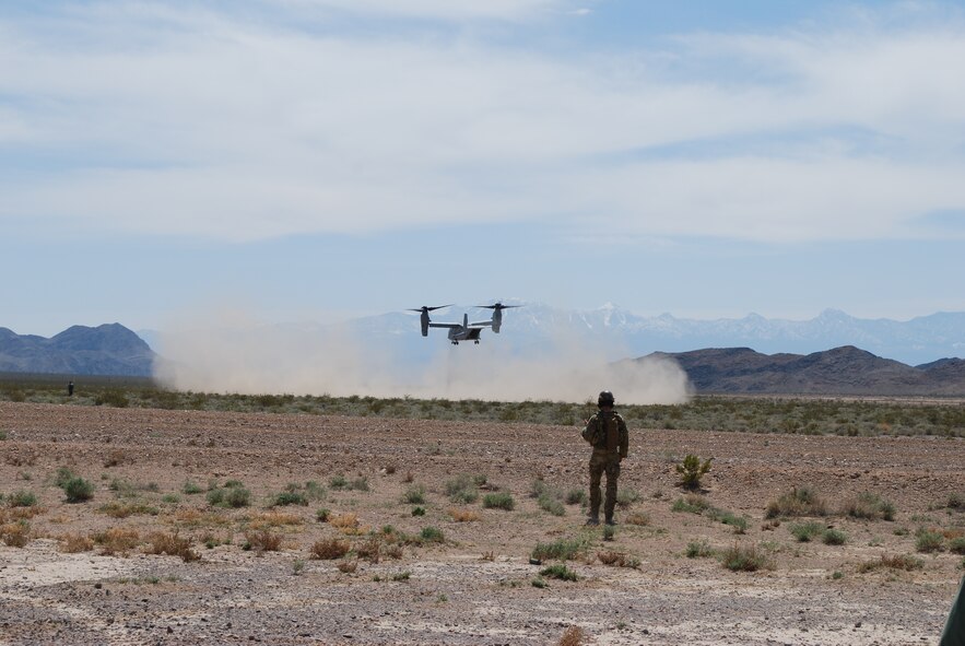 A joint tactical air controller observes the MV-22 Osprey's approach during a personnel recovery mission at Nellis AFB, Nev., during the Joint Expeditionary Forces Experiment 2010, which took place April 12 through 23.  (Courtesy photo)