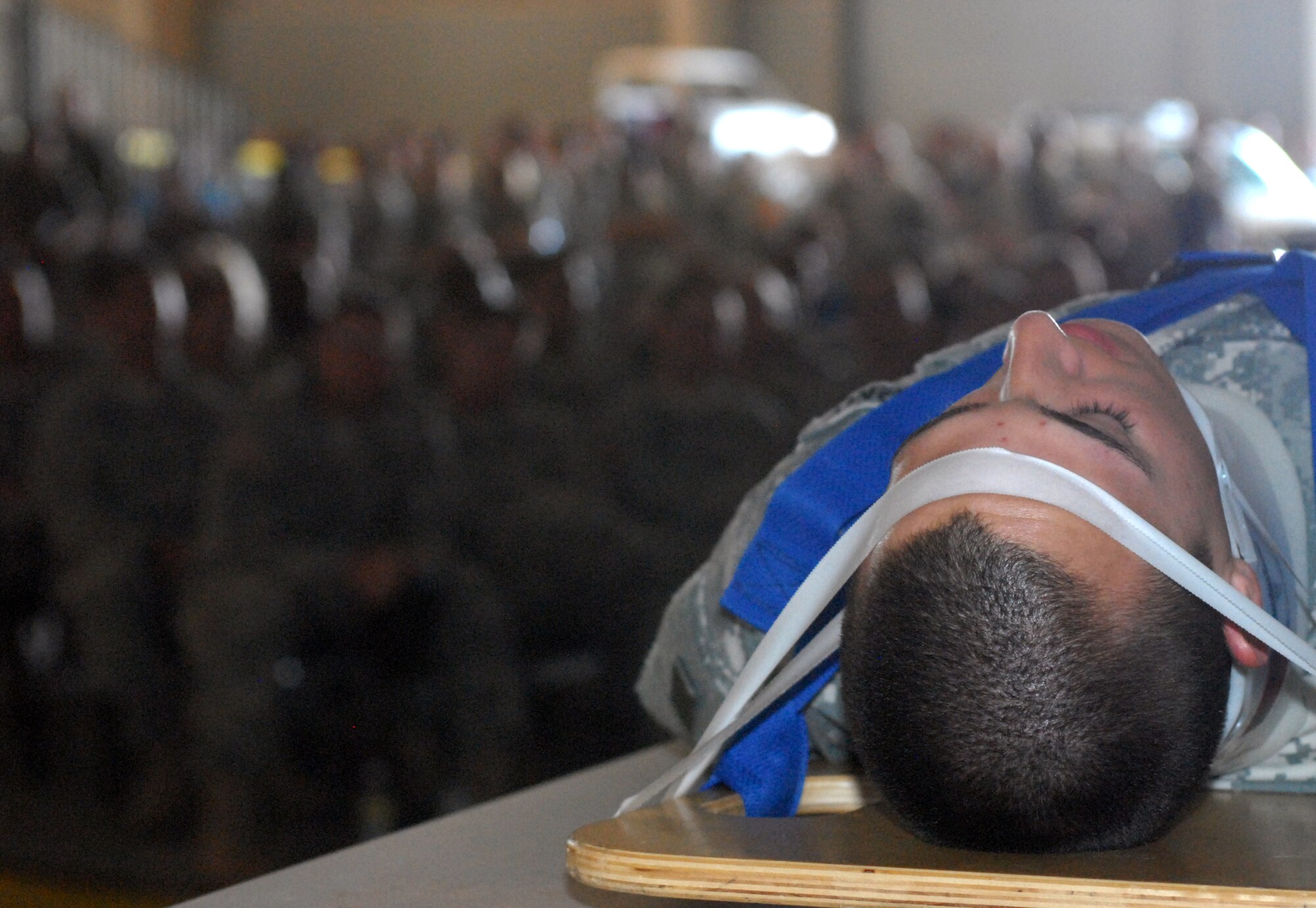 Pat Kelly, a Street Smart presenter, talks to a group of service member about the effects an automobile accident has had on Private First Class Albert Gomez’s body.  Members of Goodfellow AFB, TX where giving the opportunity to experience the consequences of bad driving habits and receive information on other safety issues during a safety day marking the start of 101 critical days of summer. (U.S. Air Force photo/Master Sgt. Randy Mallard) 