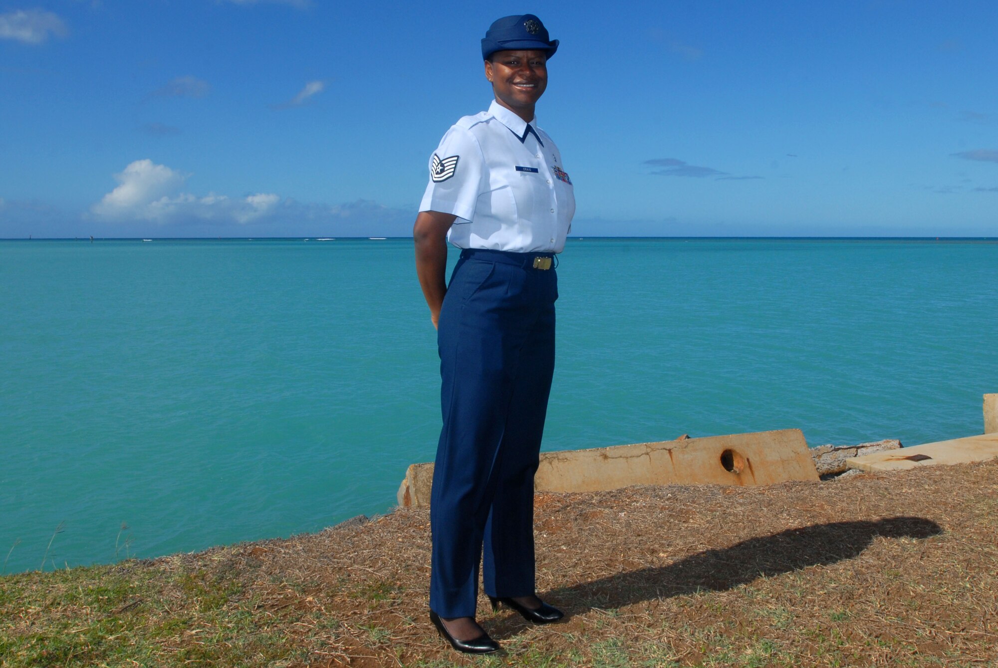 JOINT BASE PEARL HARBOR HICKAM, Hawaii – Tech. Sgt. Jenessa Craig, 647th Force Support Squadron First Term Airmen Center NCOIC, is this week’s Hickam Warrior. According to Master Sgt. Everett Jennings, 647th Force Support Squadron career assistance advisor, Sergeant Craig is an exceptional leader and has a passion for excellence. “As Team Hickam's Career Assistance Advisor I could not ask for a better NCOIC to run our FTAC. Her leadership style is the perfect mix of accountability, fairness, and compassion which are all essential to being a great FTAC NCOIC!” he said. According to Sergeant Craig, more emphasis on the Sponsorship Program, especially for first term airmen, is needed. “If Airmen are received well and shown around the base and local areas, they are likely to have a positive outlook on their units.” she said.  Sergeant Craig’s job is to transition first term airmen from a training mindset to a mission-oriented environment and to reinforce lessons learned in Basic Military Training. “I love helping new Airmen adjust to the operational Air Force.” she said.  “I enjoy providing guidance, mentorship and setting them up to begin a successful Air Force career. I truly have the best job in the Air Force!” According to Sergeant Craig, she enjoys the beautiful blue skies and the tropical warm breezes Hawaii has to offer. “I love the mountain views and the clear ocean waters.” she said. “This is truly the most beautiful place on earth!” (U.S. Air Force photo/Senior Airman Gustavo Gonzalez)