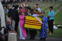 HONOLULU - Vietnamese Americans lead a procession of ceremonial wreaths at the National Cemetery of the Pacific in the Pu'owaina Crater, also known as the Punchbowl during a Vietnam Veteran and wreath laying ceremony on May 30. Military veterans, motorcycle clubs and  Vietnam veteran supporters gathered at the Punchbowl in Honolulu, Hawaii; it was teh 22nd year of the pre-Memorial Day ceremony.  (U.S.  Air Force photo/Tech Sgt. Cohen A. Young)
